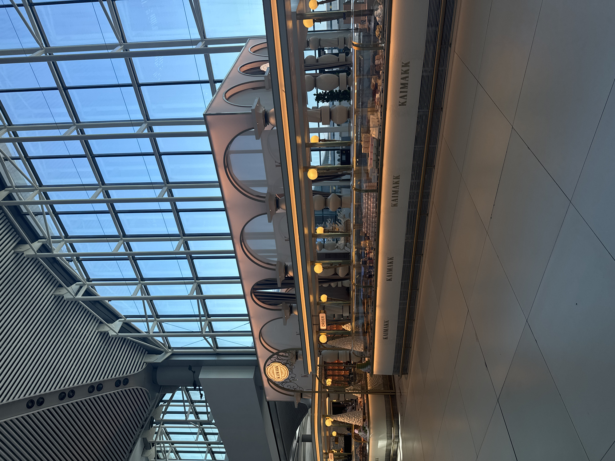 Moving through Istanbul Airport terminal with shopping bag in hand