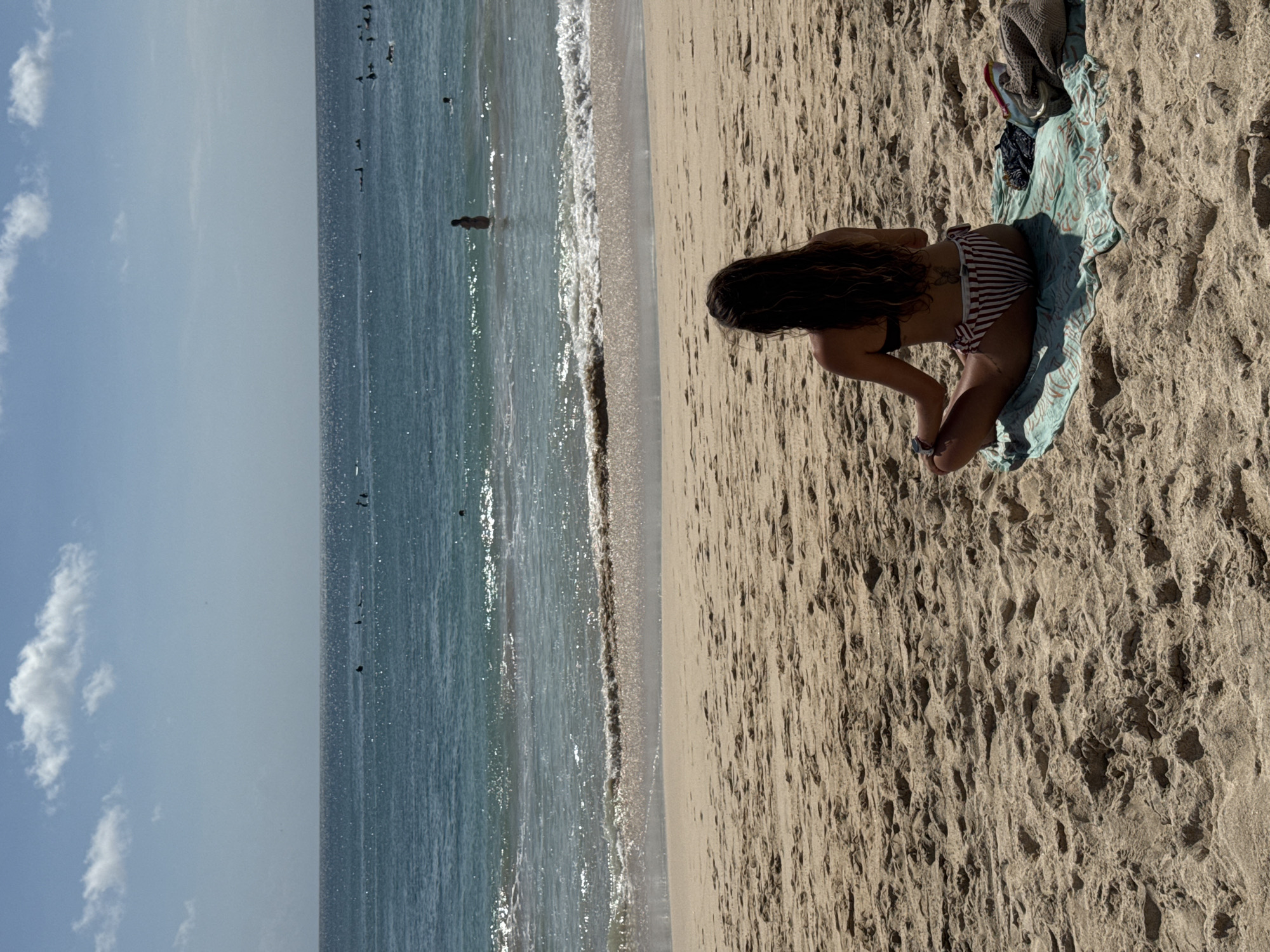 Morning beach life unfolds in Kuta Selatan, Indonesia