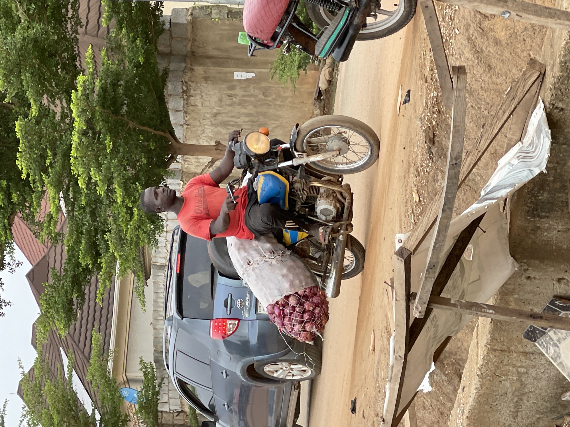 Morning street life documented across Abuja residential areas
