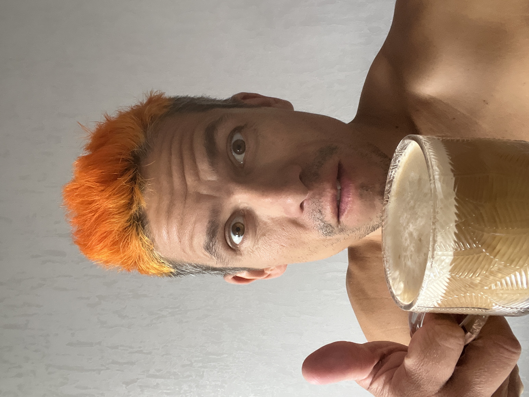 Orange-haired cyclist documents coffee break with cat in Chaikovsky