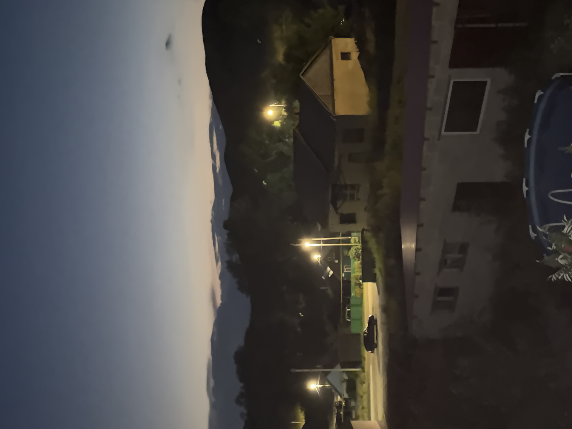 Summer dusk over a quiet Mednogorsk neighborhood