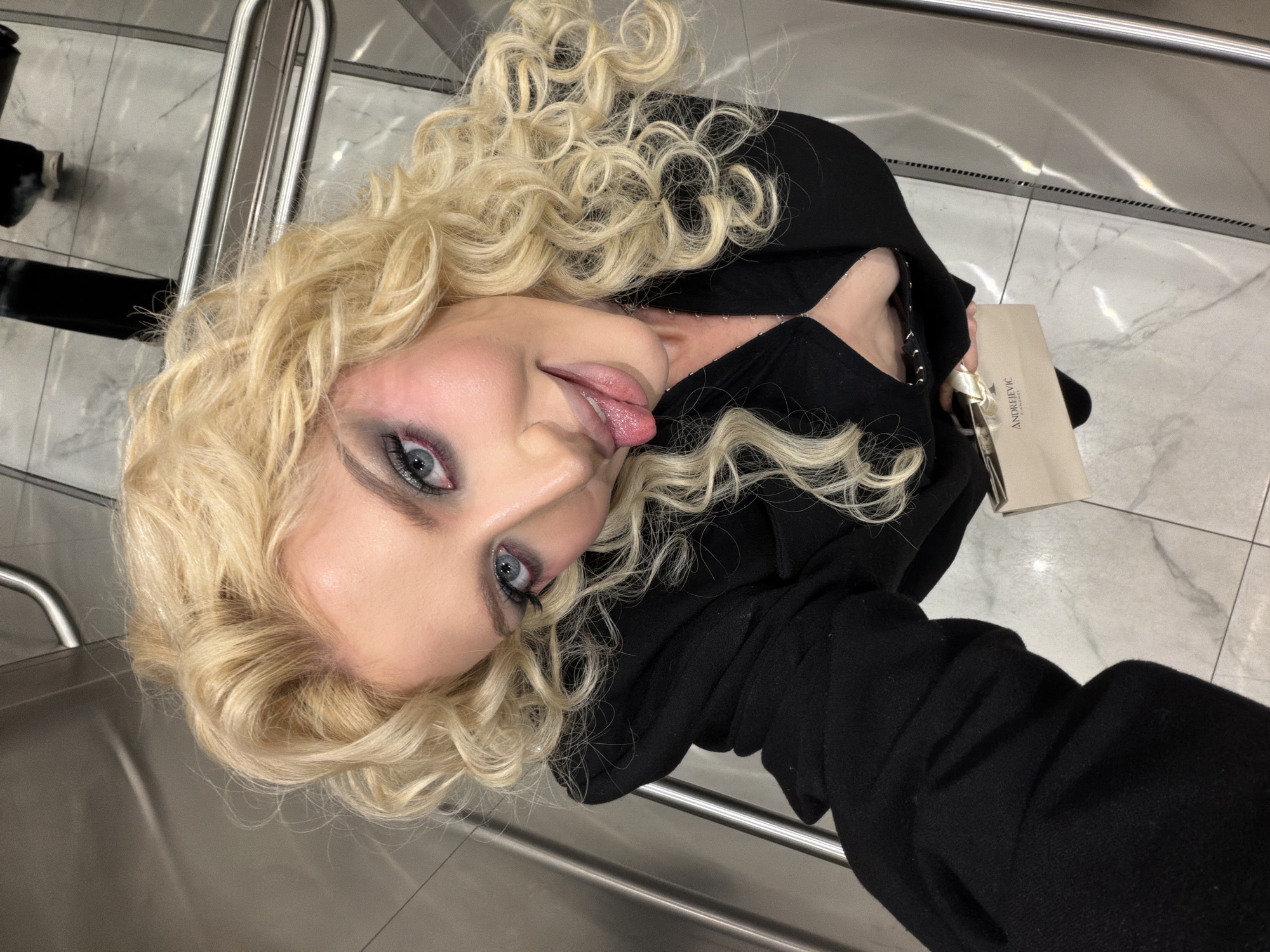 Woman takes selfie at Belgrade shopping location
