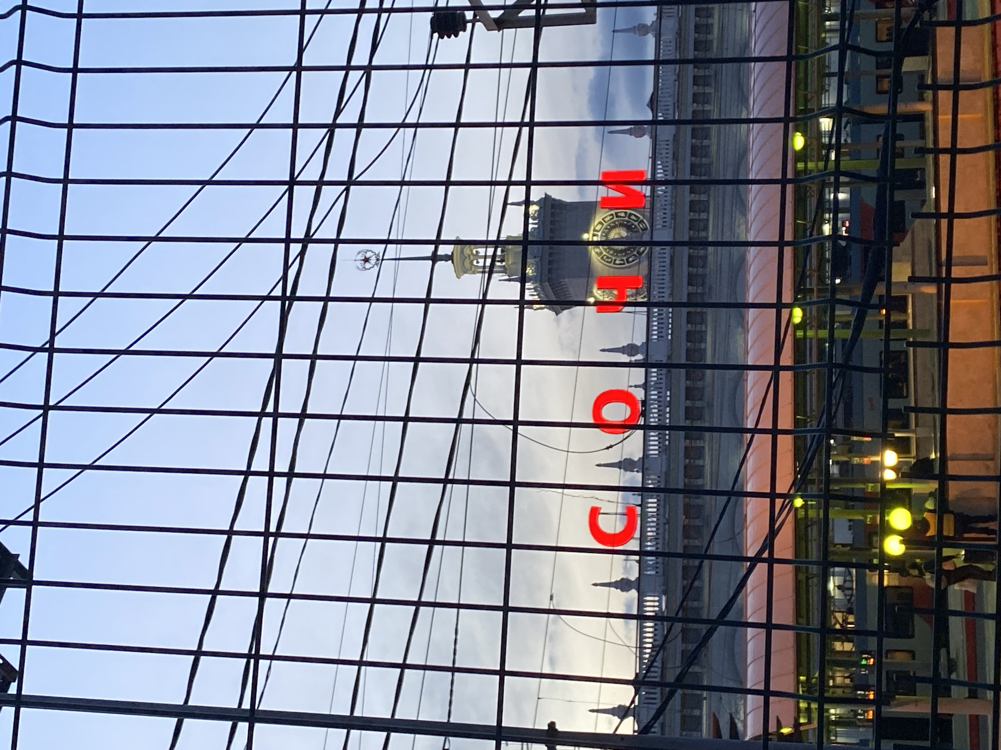 Sochi Sea Port building observed through fence under overcast sky