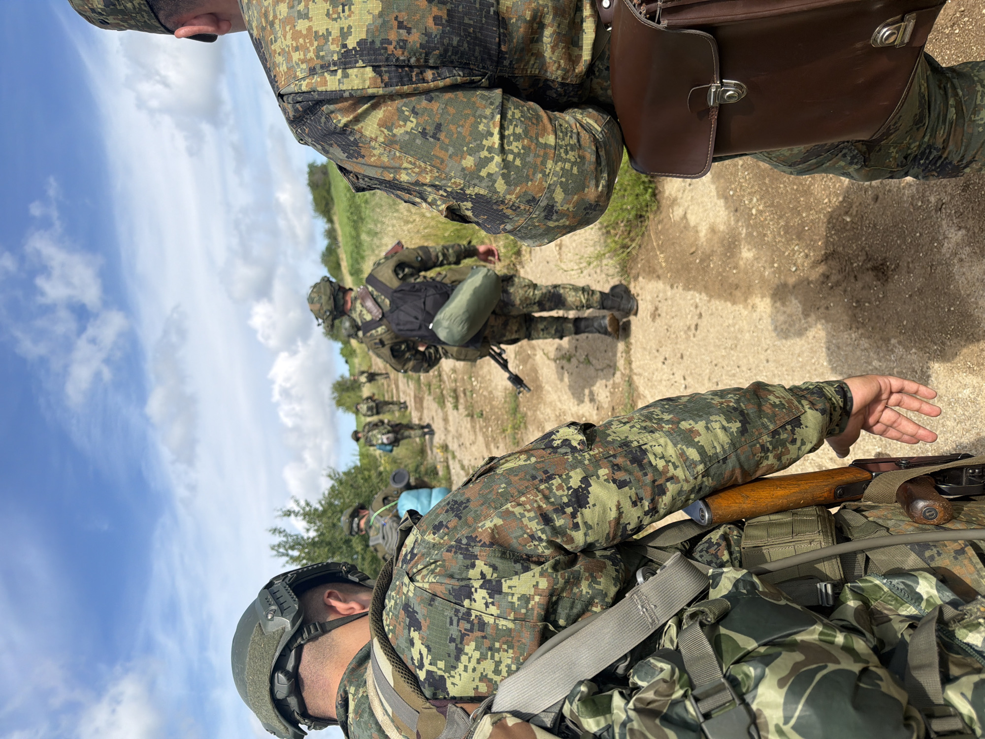 Soldiers on foot patrol along a dirt path in Bulgaria