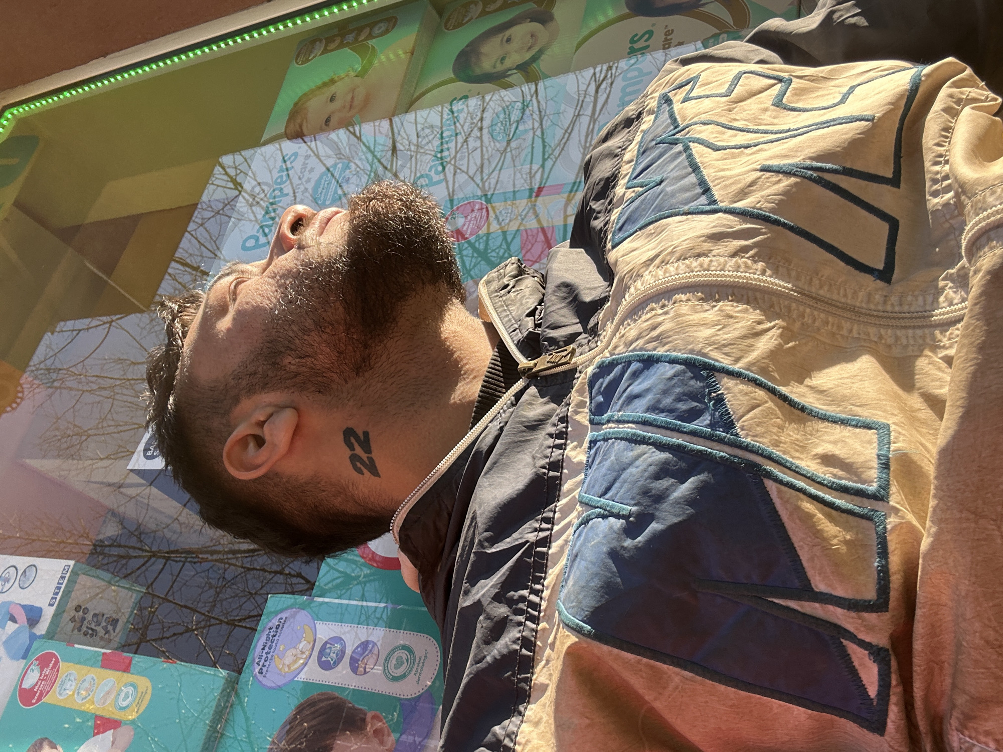 Man studies bus advertisement in early morning Tsarevo
