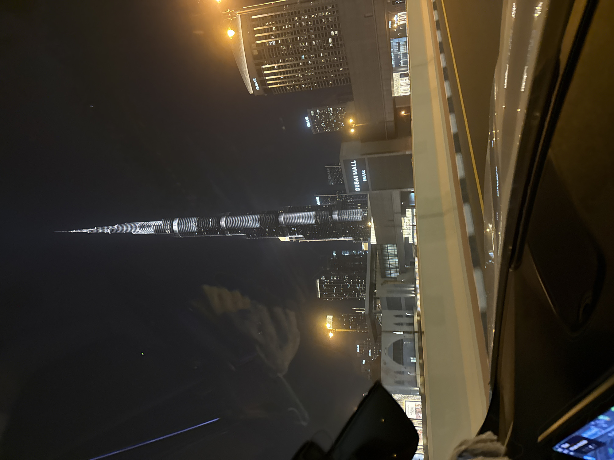 Witness captures Dubai skyline view featuring illuminated Burj Khalifa