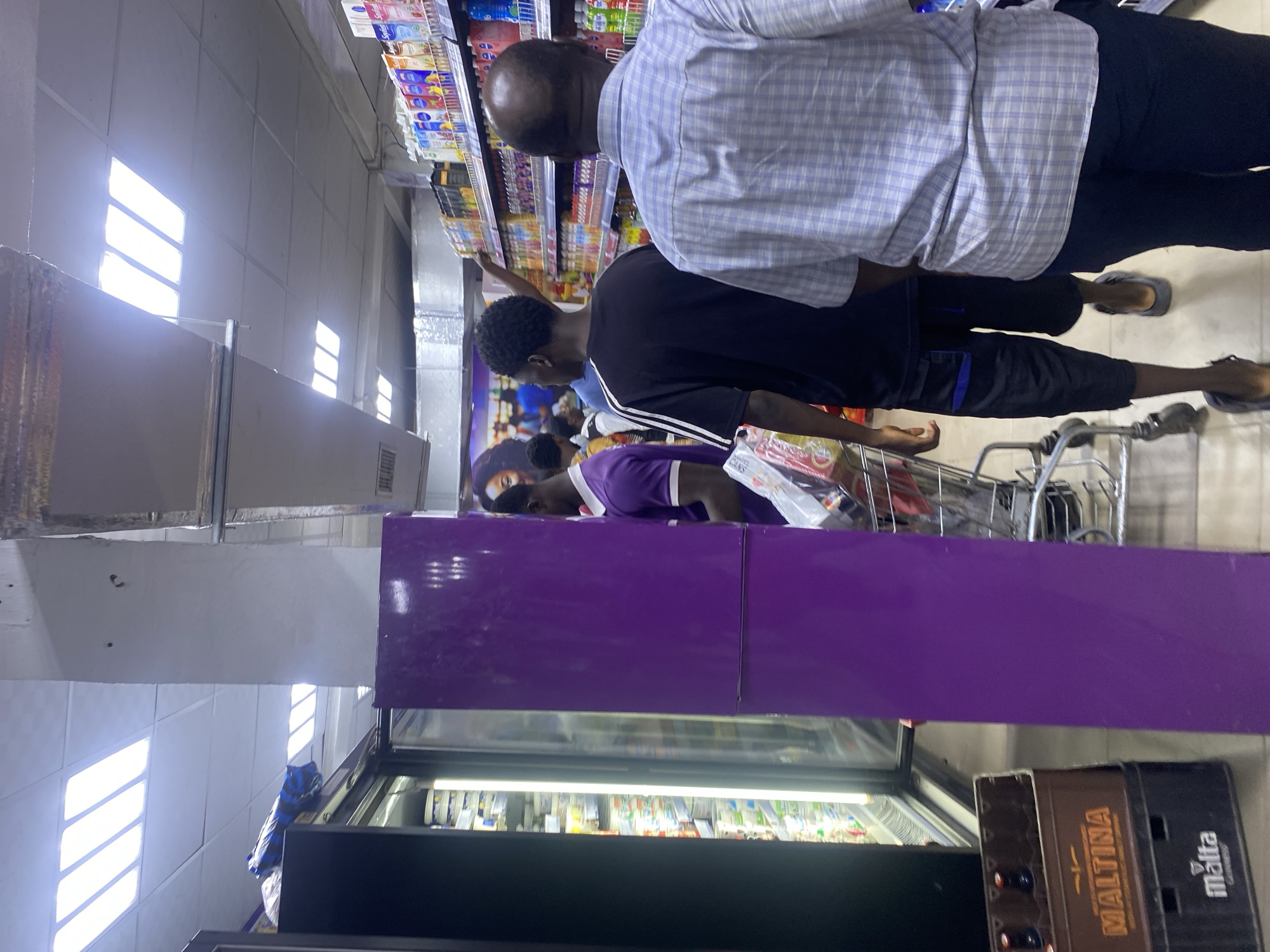 Shopper documents routine grocery store visit in Lagos