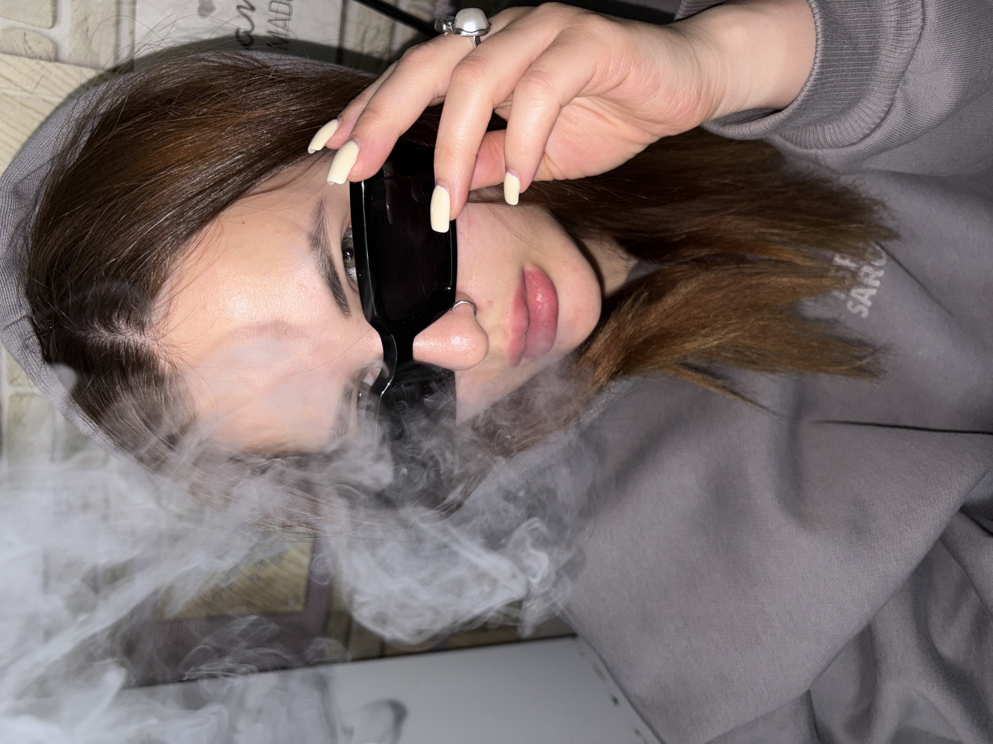 Person vaping captured in portrait photos in Port-Katon