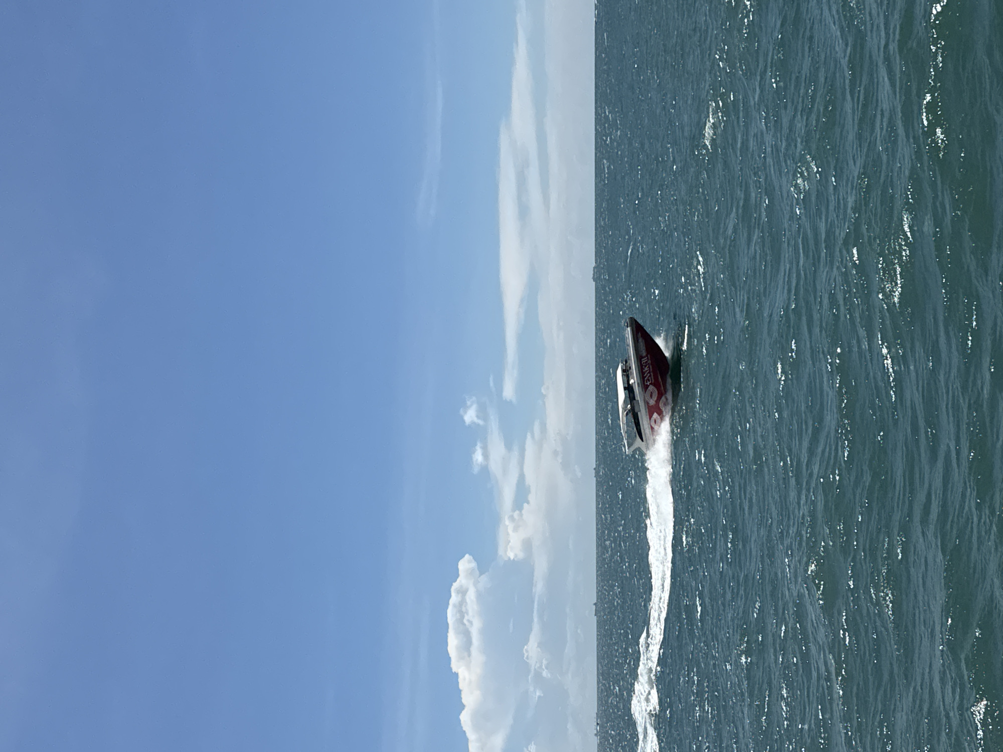 Red and white speedboat spotted crossing waters near Pattaya