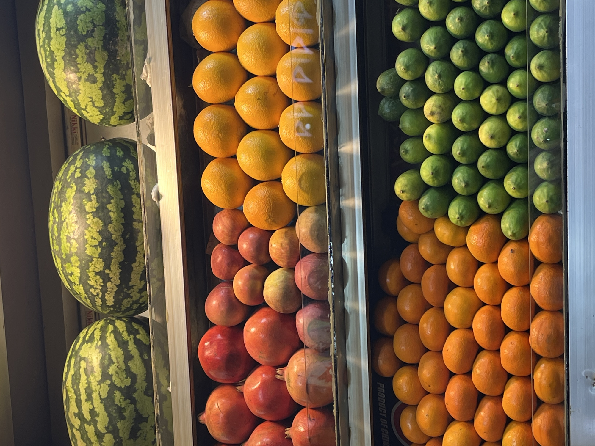 Fruit vendor displays fresh produce at Dhaka market