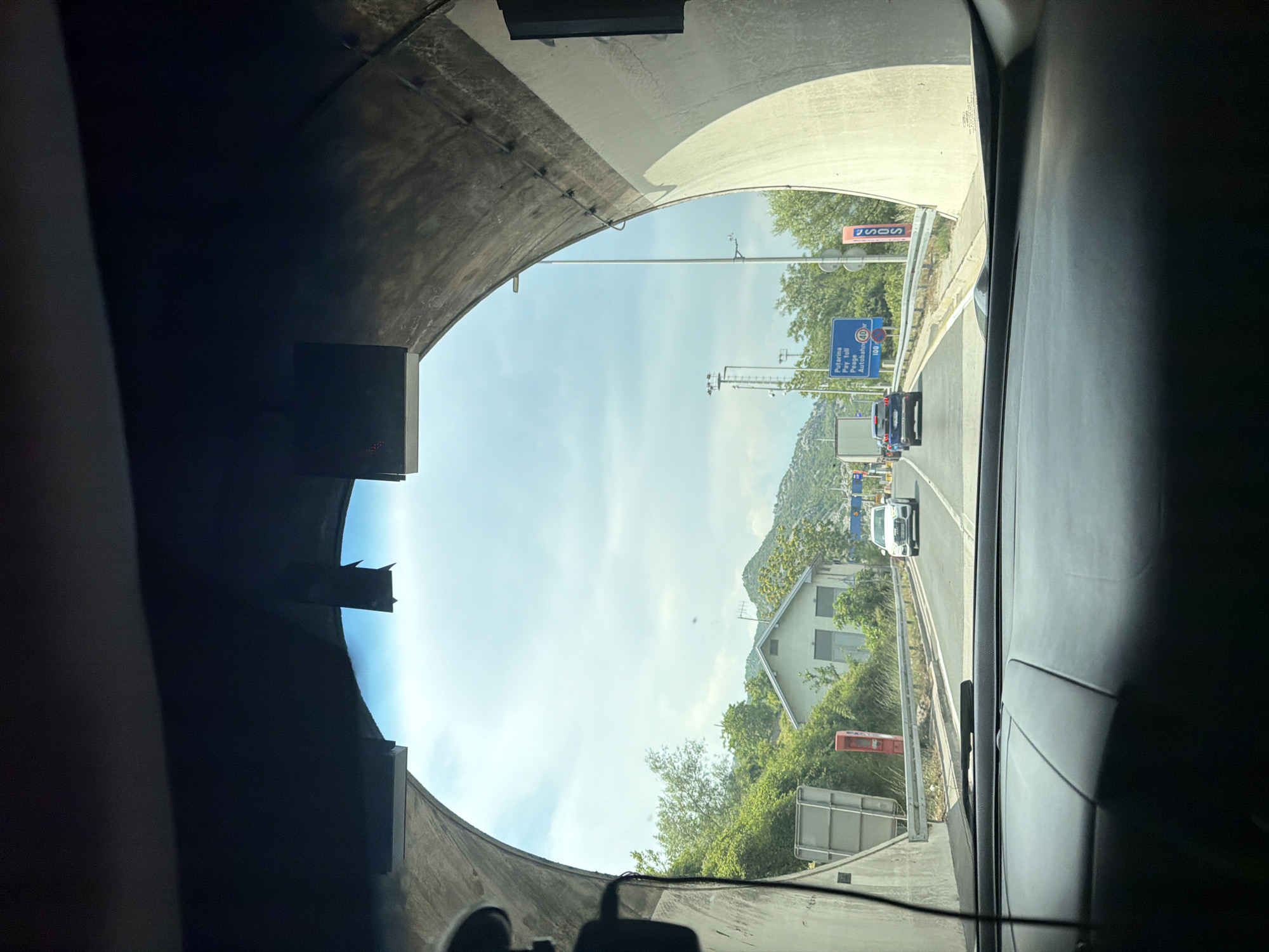Emerging from Sozina tunnel into overcast Montenegro roads