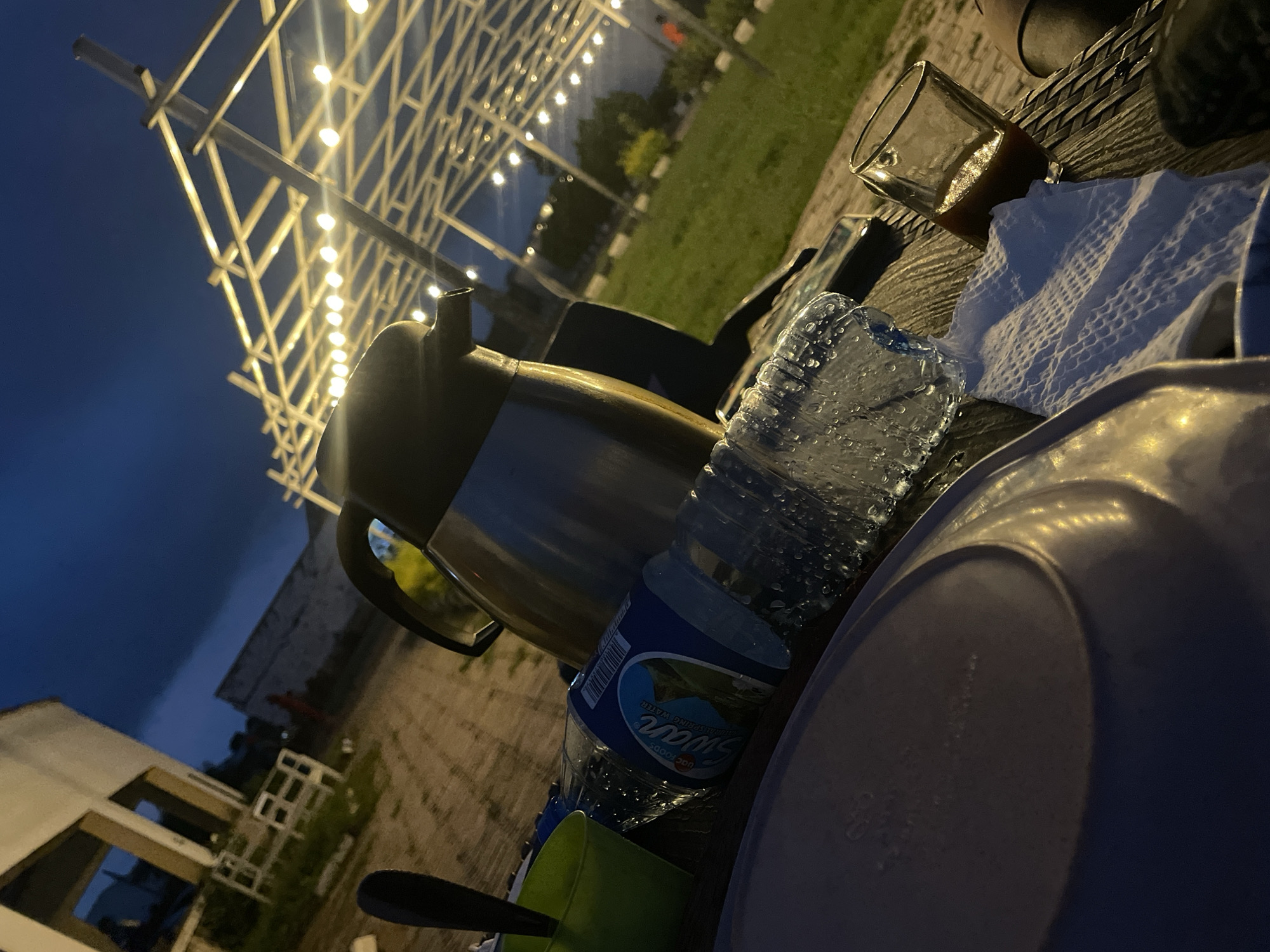 Outdoor cafe in Gura Top glows at dusk and into the night