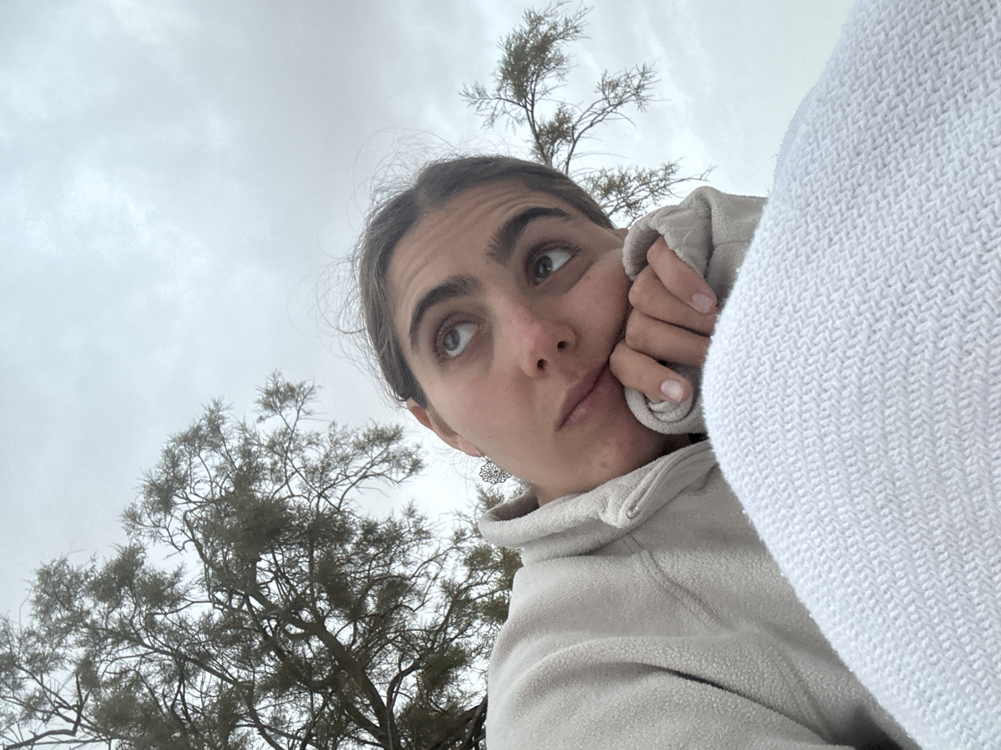 Woman takes outdoor selfies during camping trip in Israel