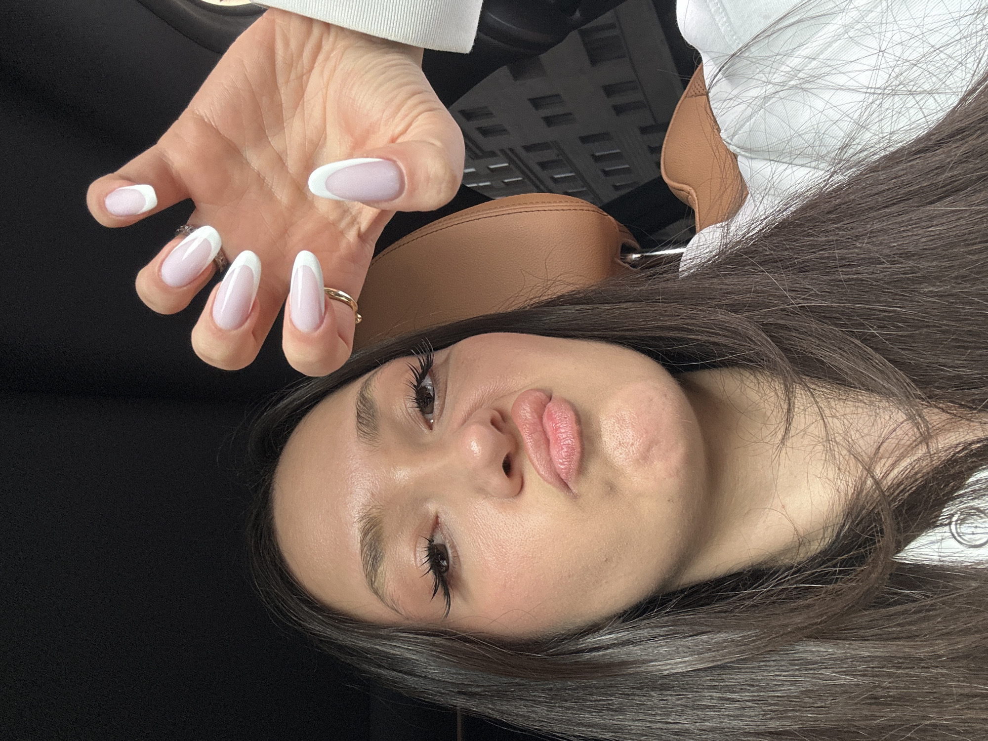 Woman takes playful selfies in BMW interior, Yerevan