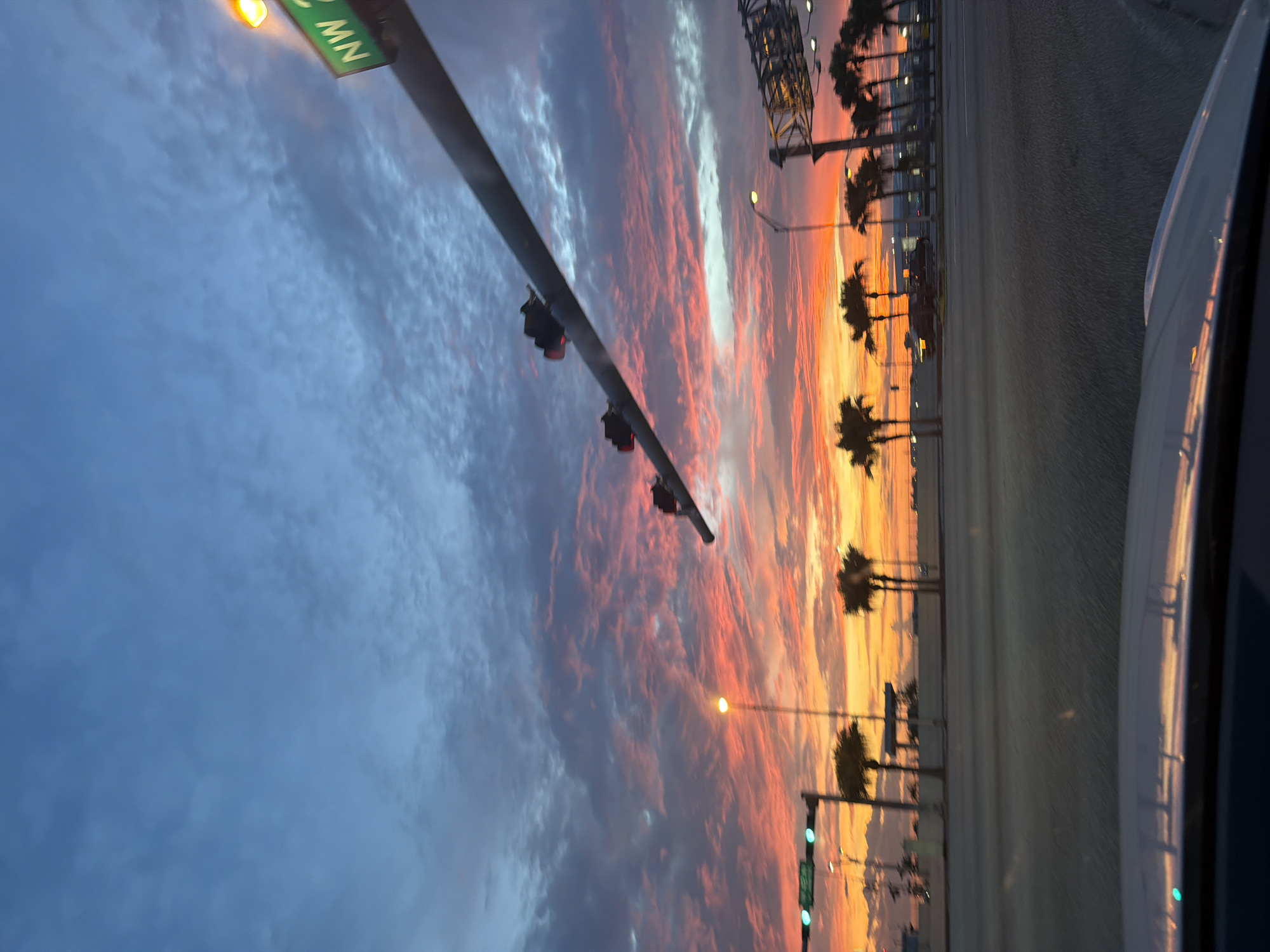 Sunset drive through Miami with dramatic colorful sky