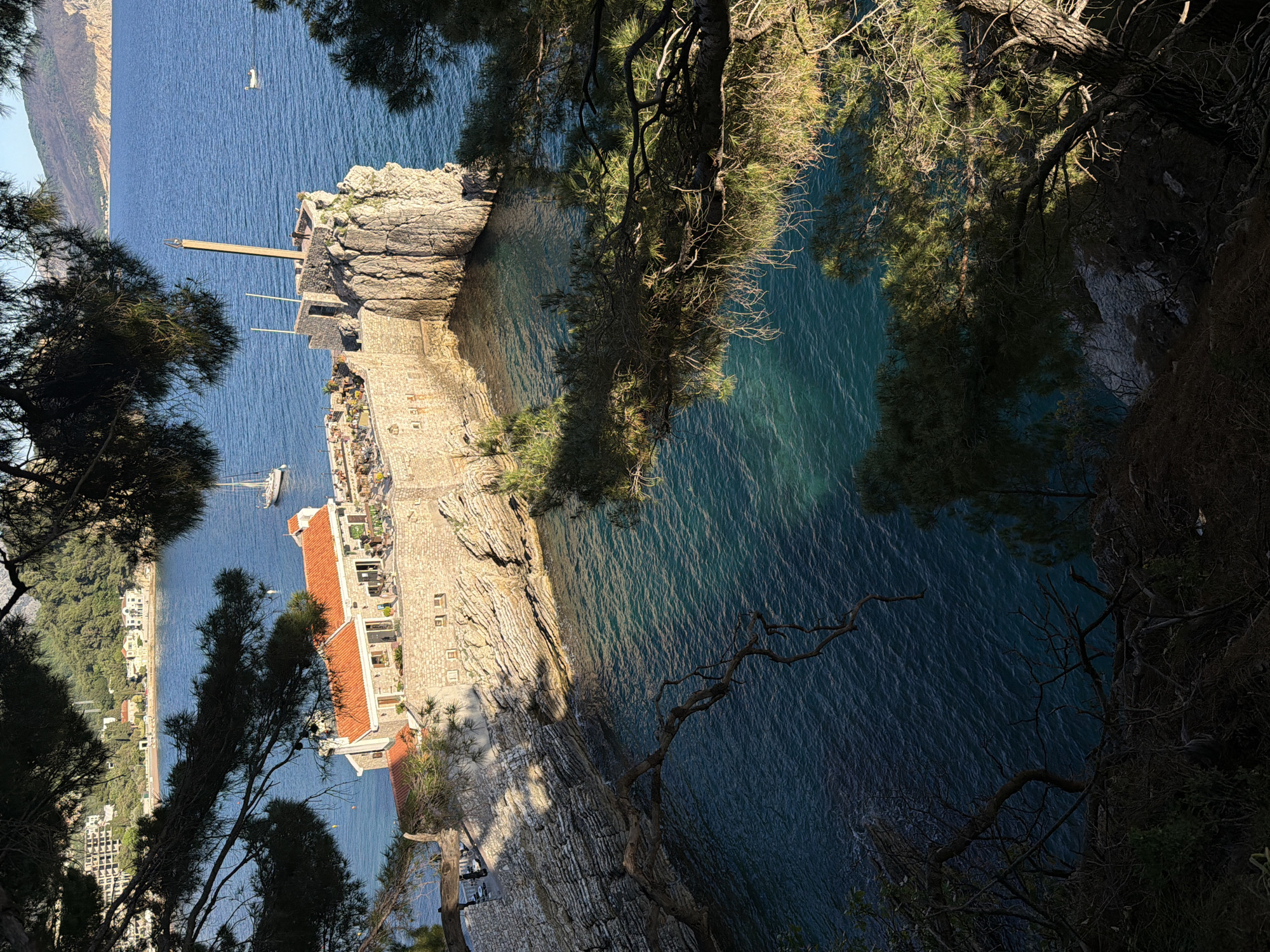 Aerial view captured of Petrovac coastal town from cliff