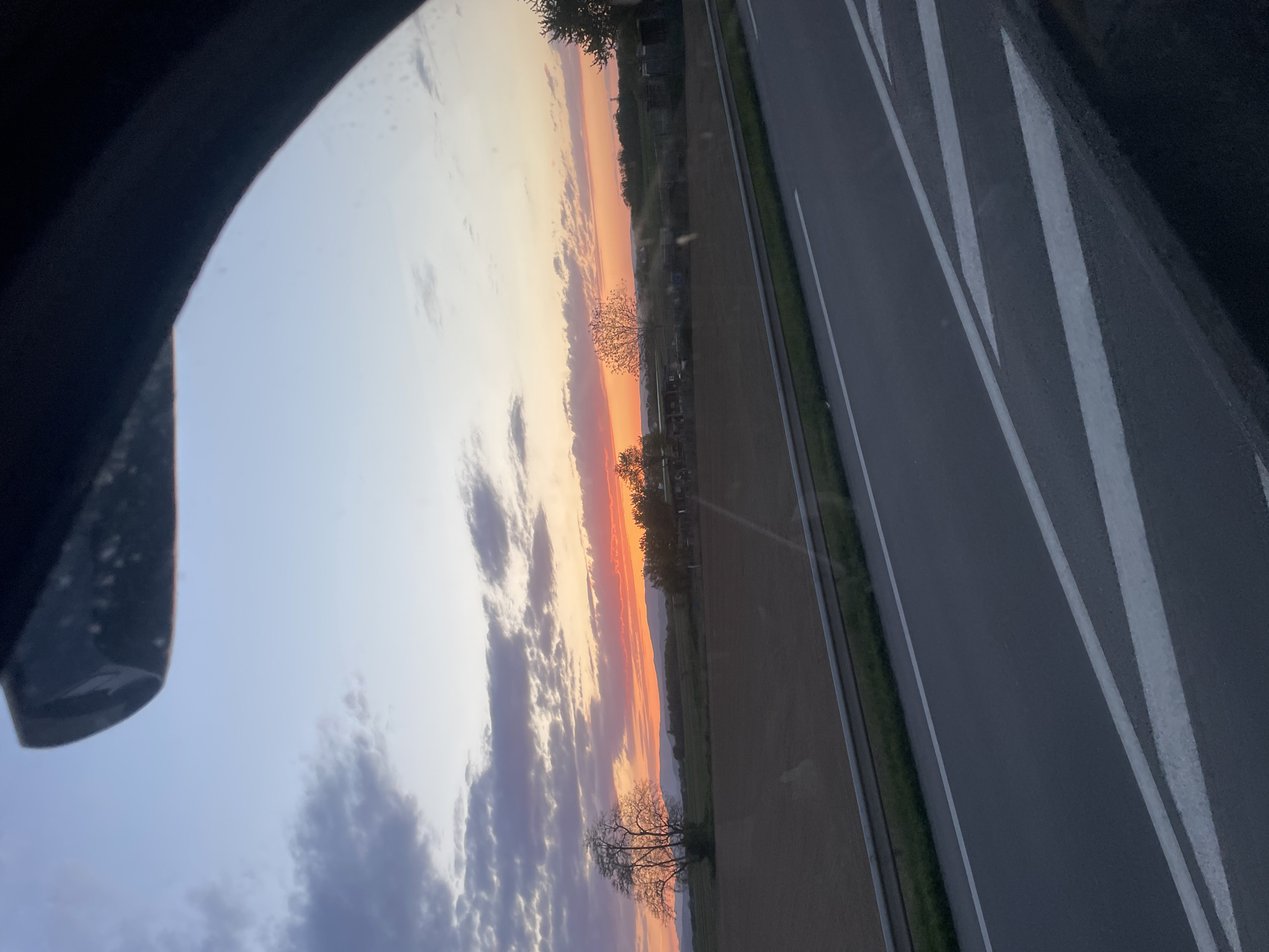 Sunset viewed from car window in Geispolsheim, France