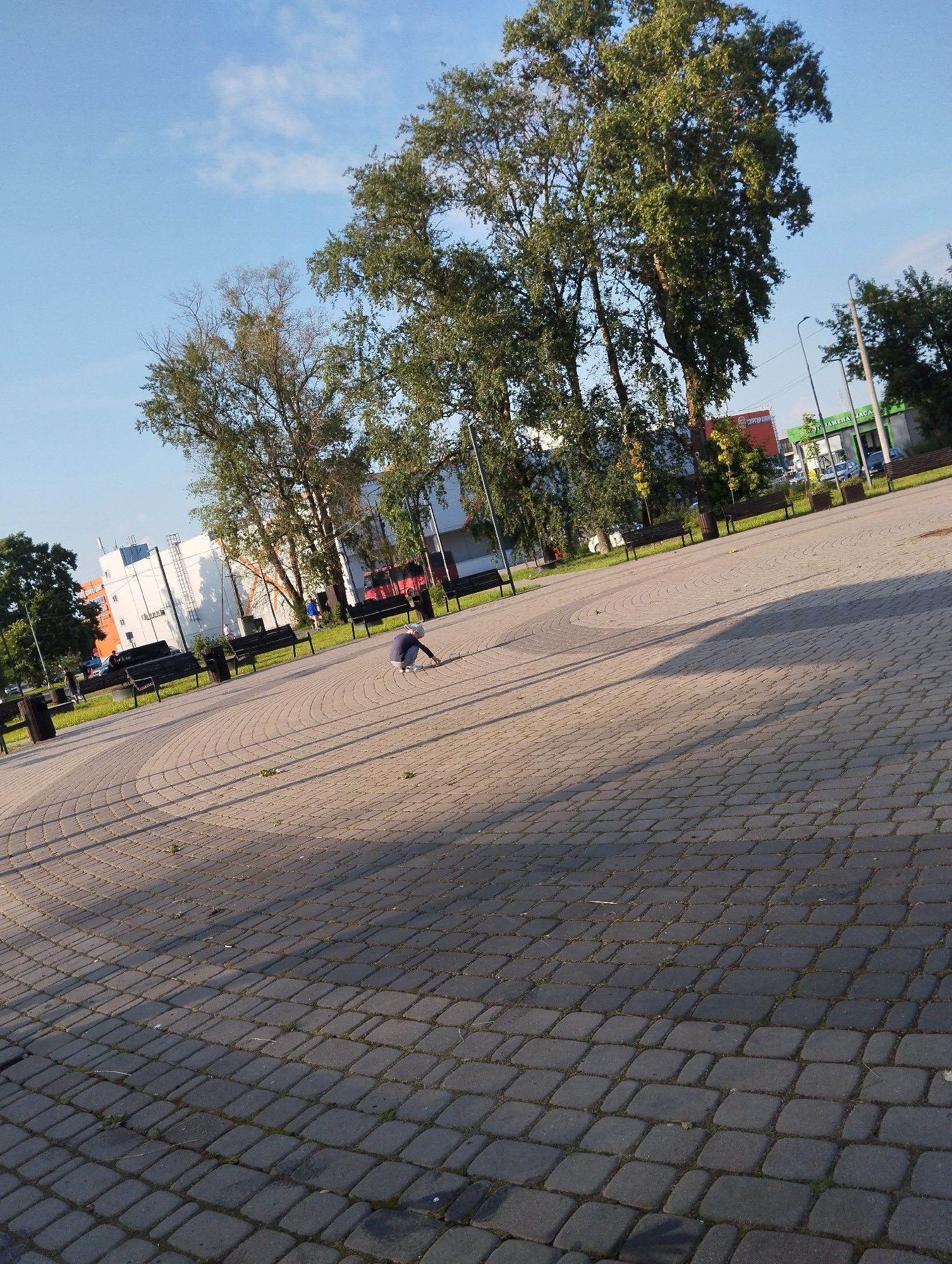 Sunny afternoon at a brick plaza in Kingisepp, Russia