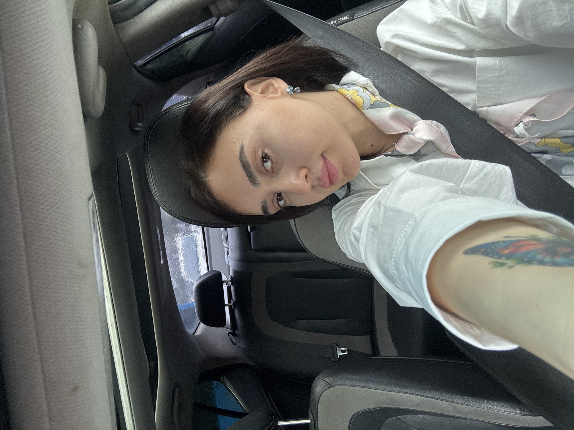 Person observed in car during rainy morning in Tbilisi