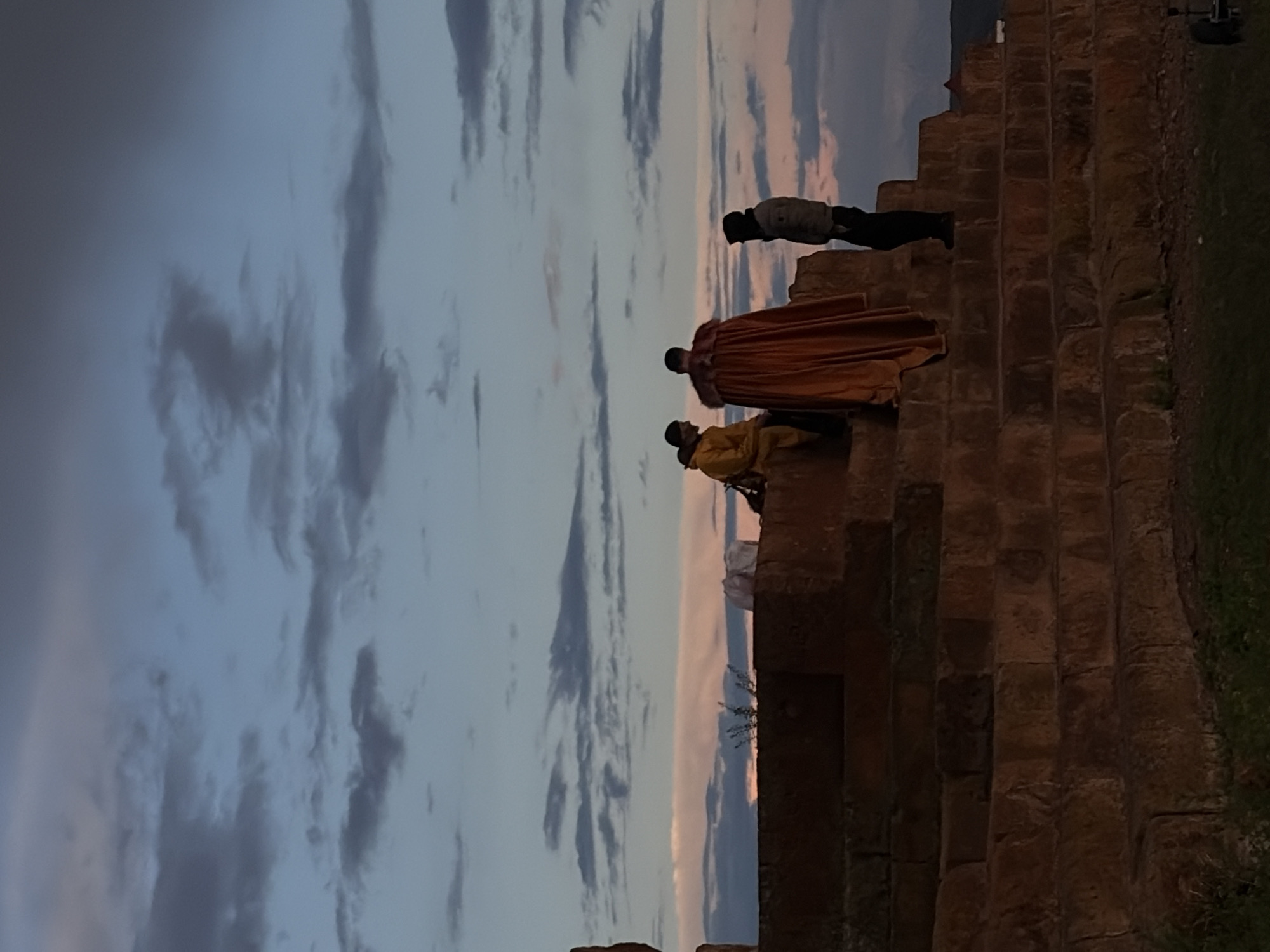 Teal-haired visitor explores historic ruins and landscapes in Anipemza