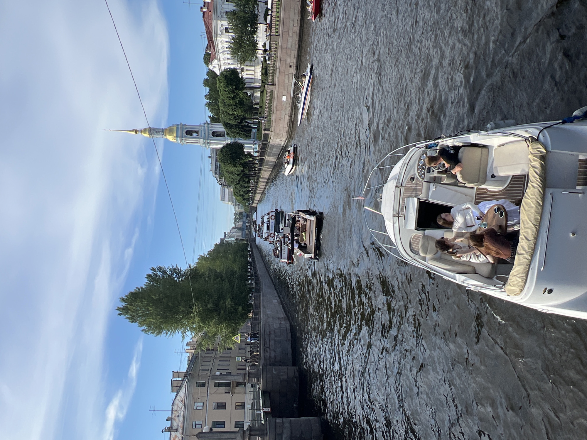 Afternoon boat traffic on Saint Petersburg's sunny canals