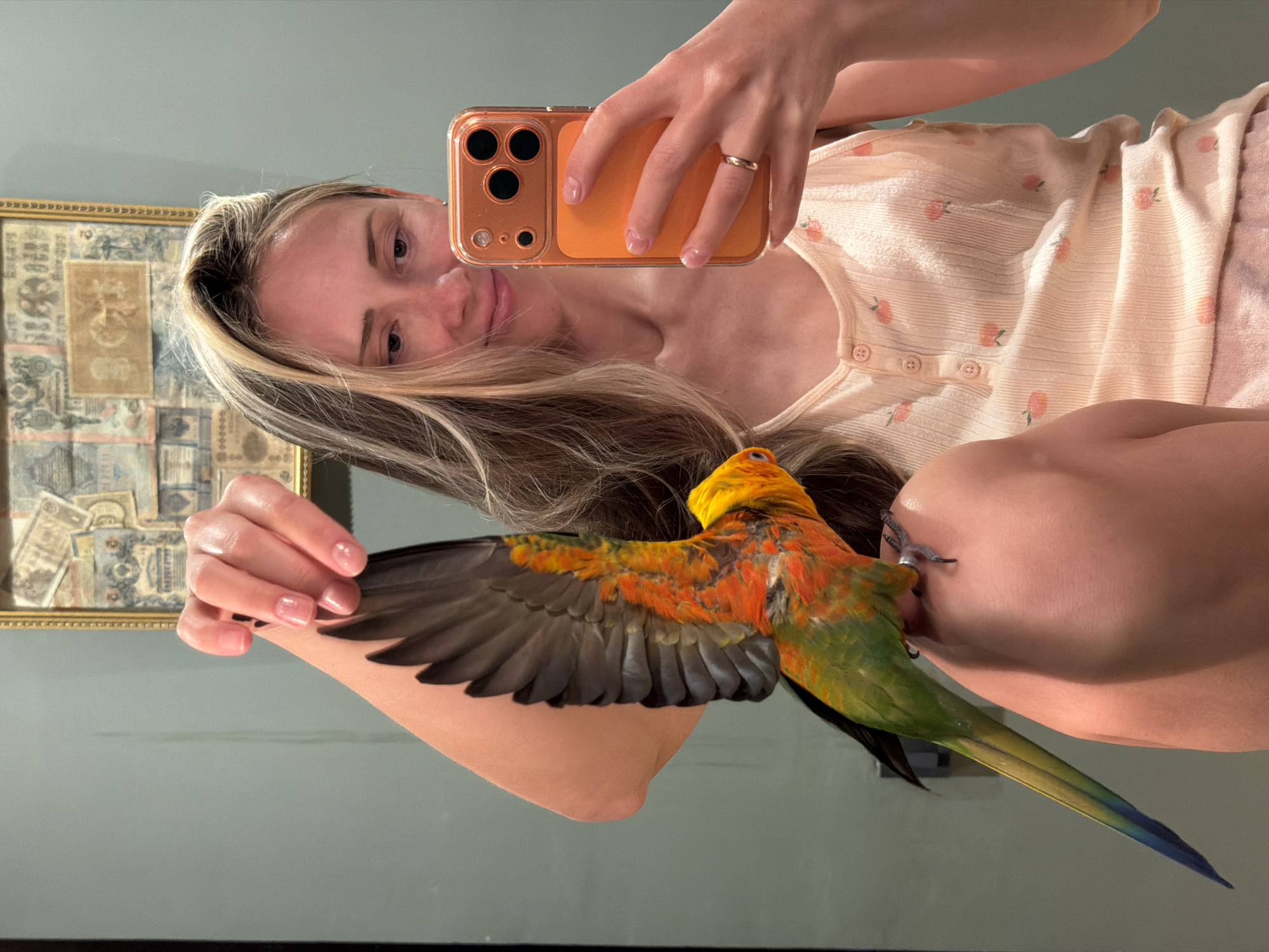 Woman takes selfies with parrot while cooking in Khimki