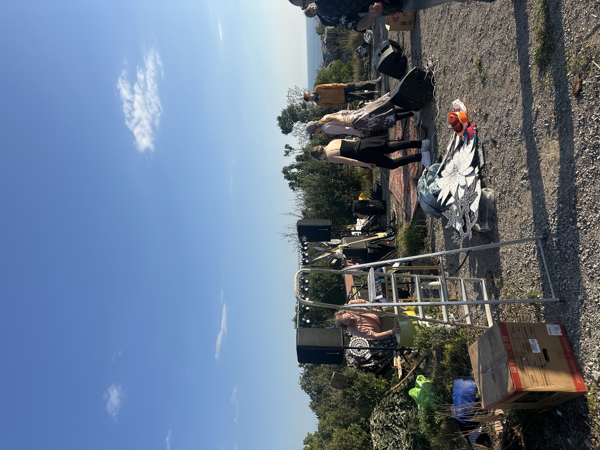 Outdoor gathering with fires, scattered objects documented across Montenegro villages