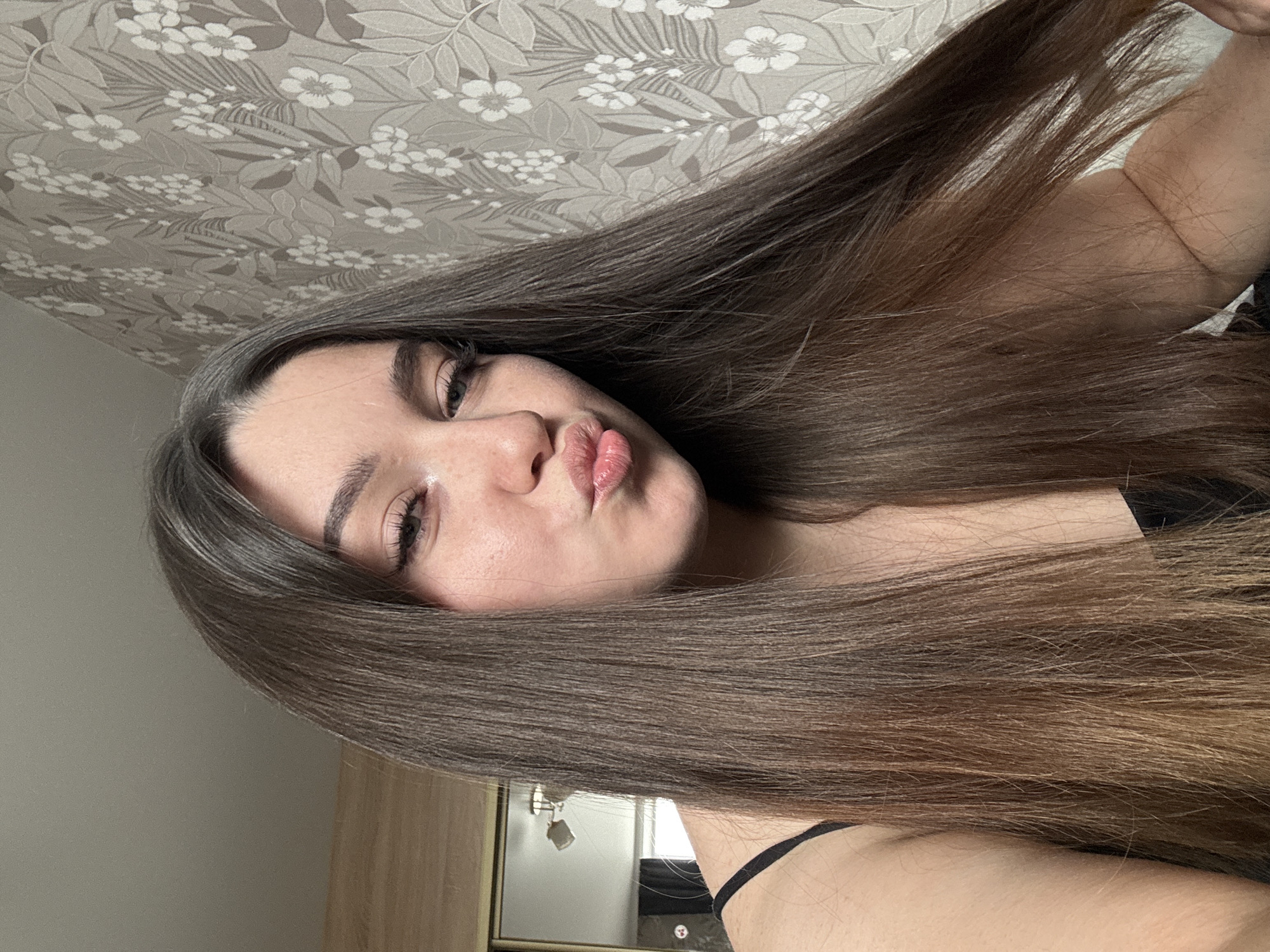 Woman takes selfies while vaping indoors in Perm