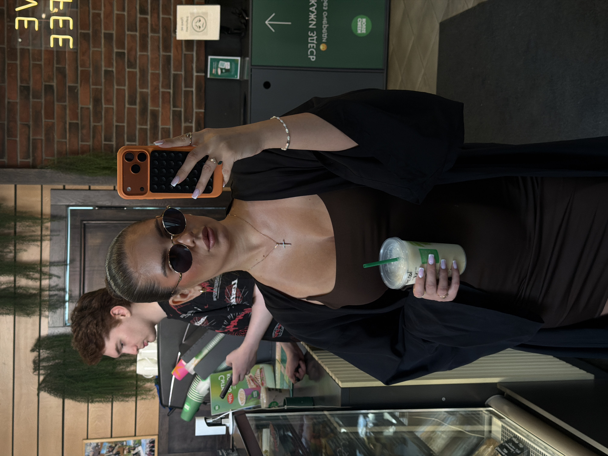 Mirror selfie at a Krasnoyarsk coffee shop