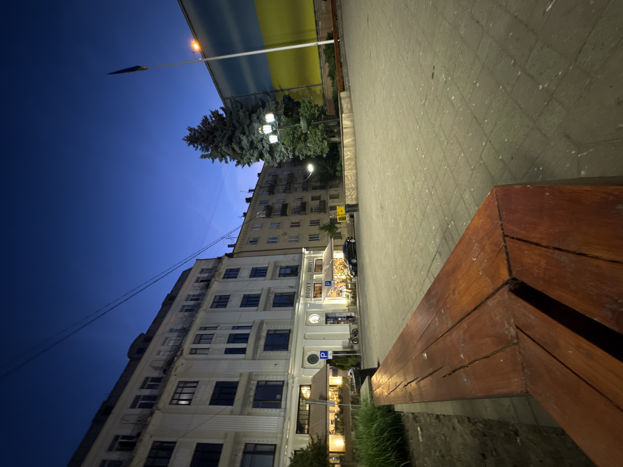 Chernivtsi city center at dusk, square and streets lit up