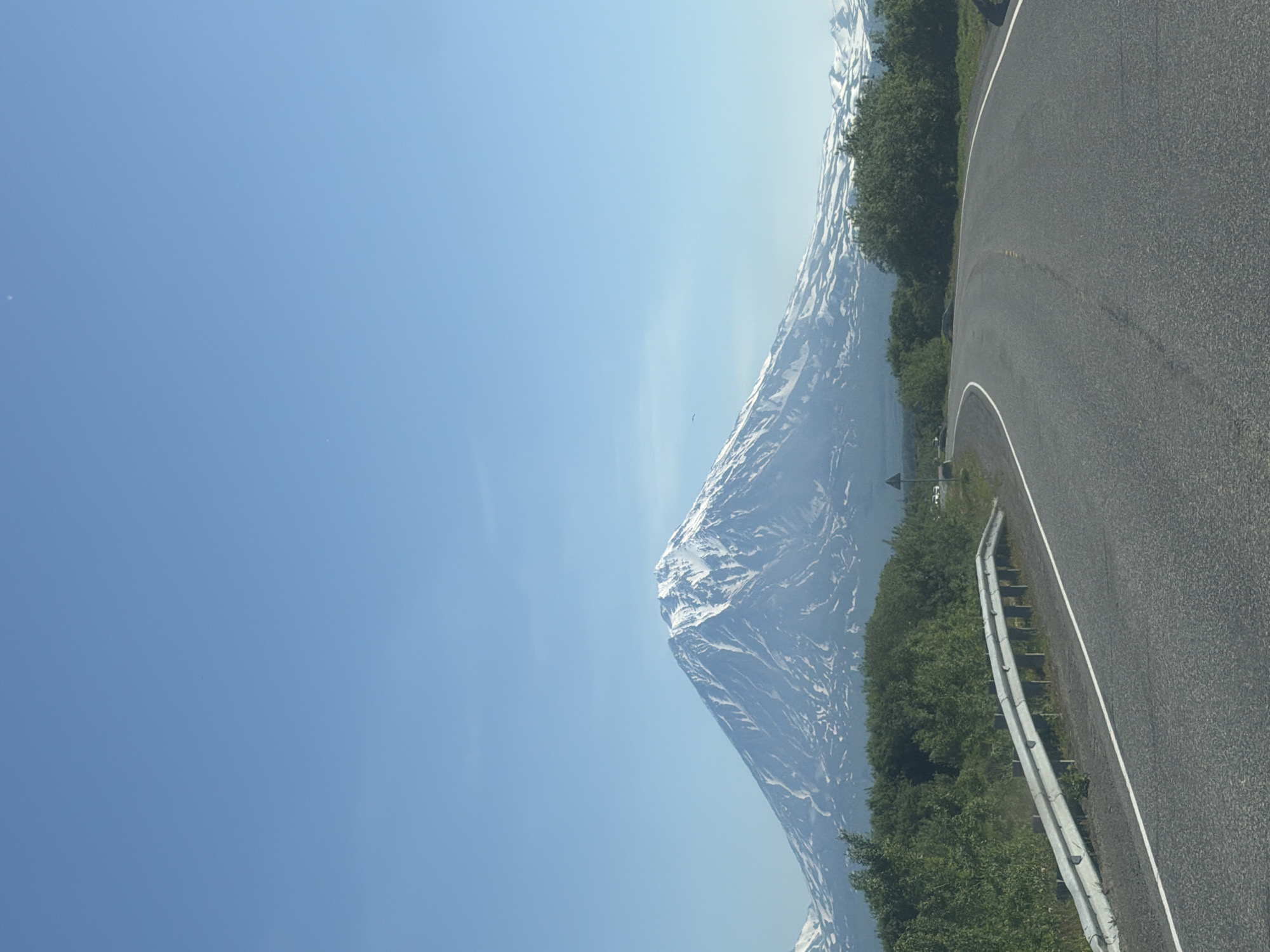 Avachinsky volcano looms over a sunny Kamchatka roadside