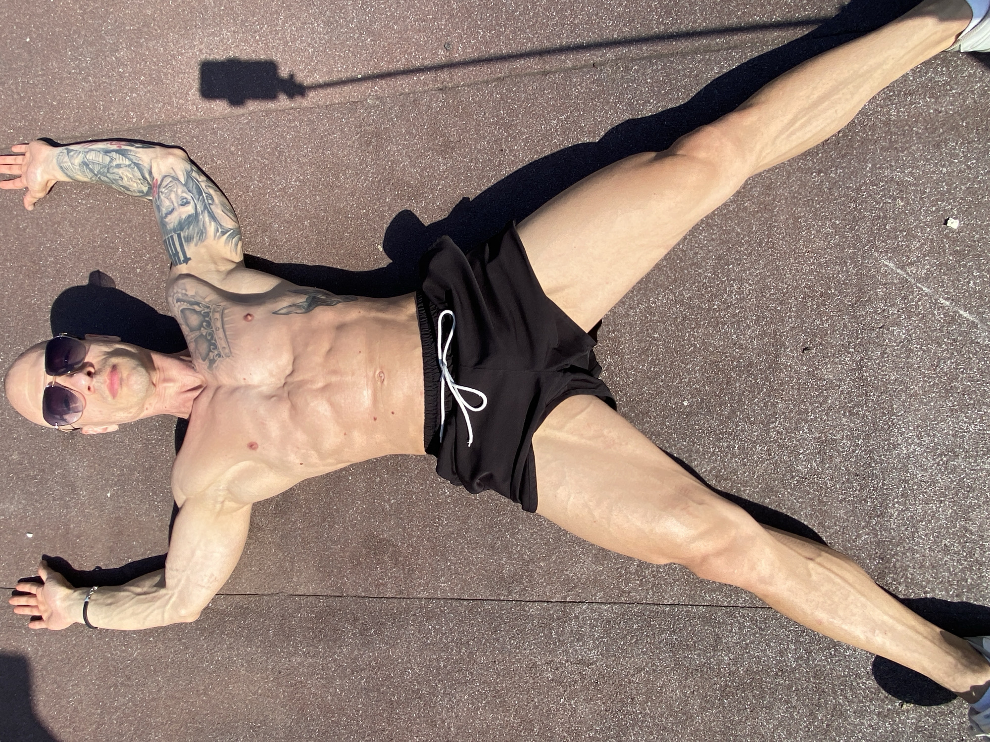 Man sunbathing on ground in Pleven, Bulgaria