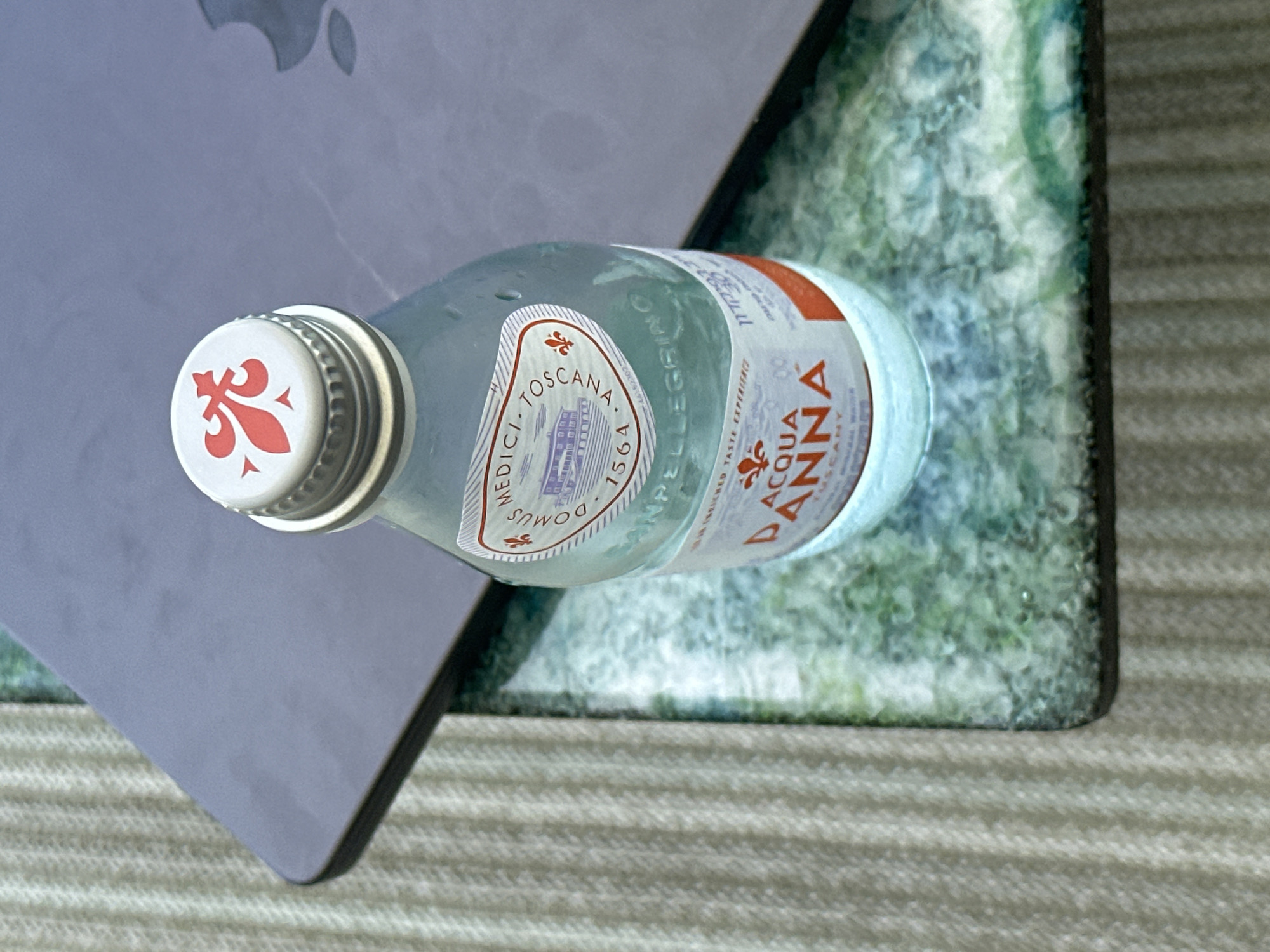 Water bottle photographed on laptop surface in Ramat HaSharon