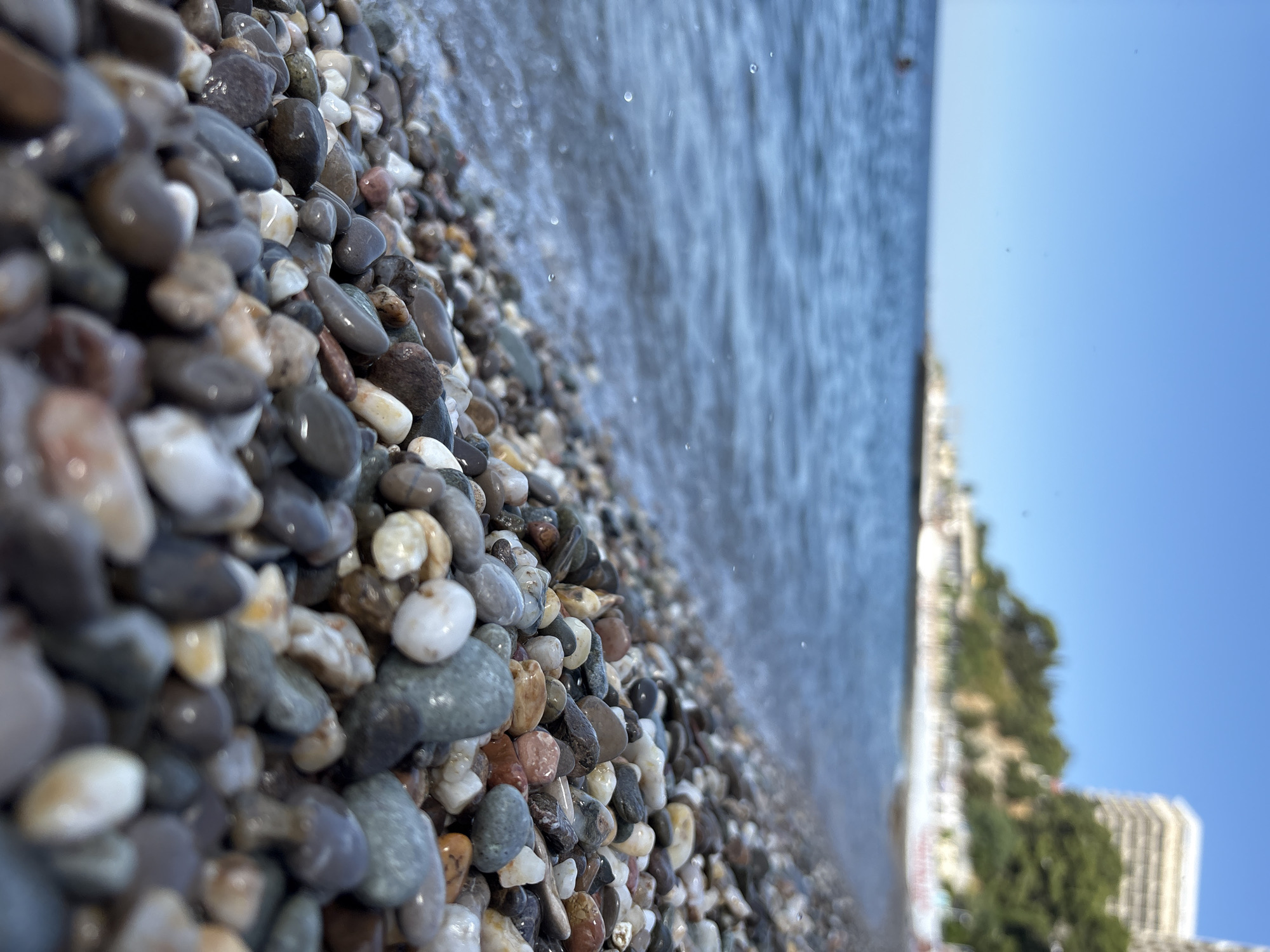 Quiet pebble beach on the Crimean coast, July morning