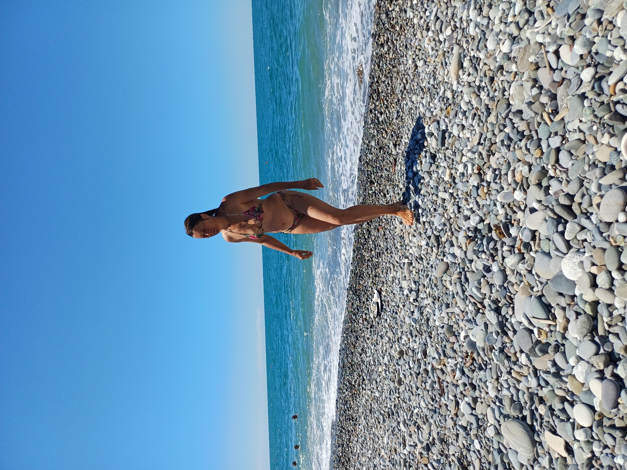 Summer morning on Sochi's Black Sea pebble beach