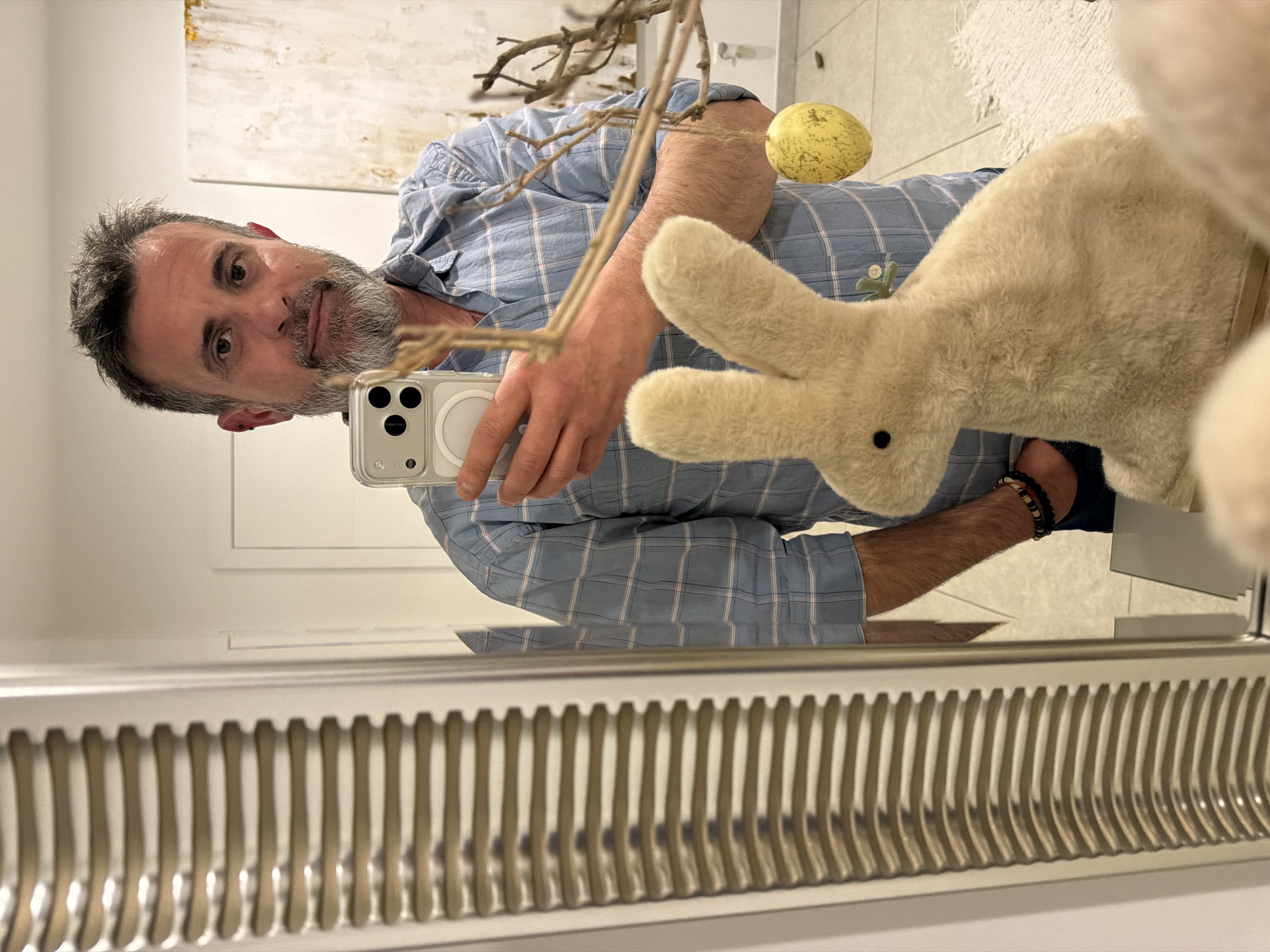 Man takes mirror selfie with iPhone in Luxembourg