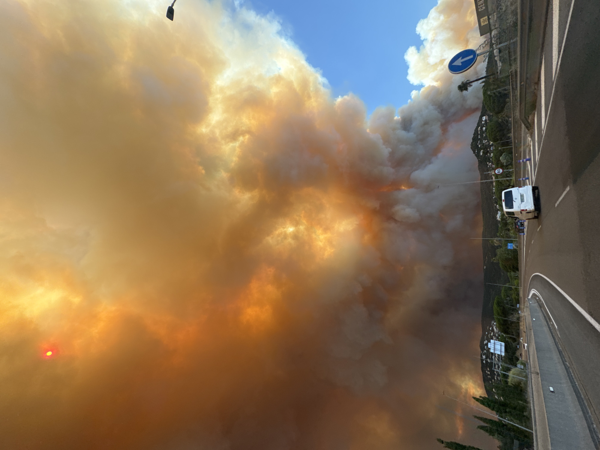 Dense wildfire smoke blankets the sky over Calonge i Sant Antoni