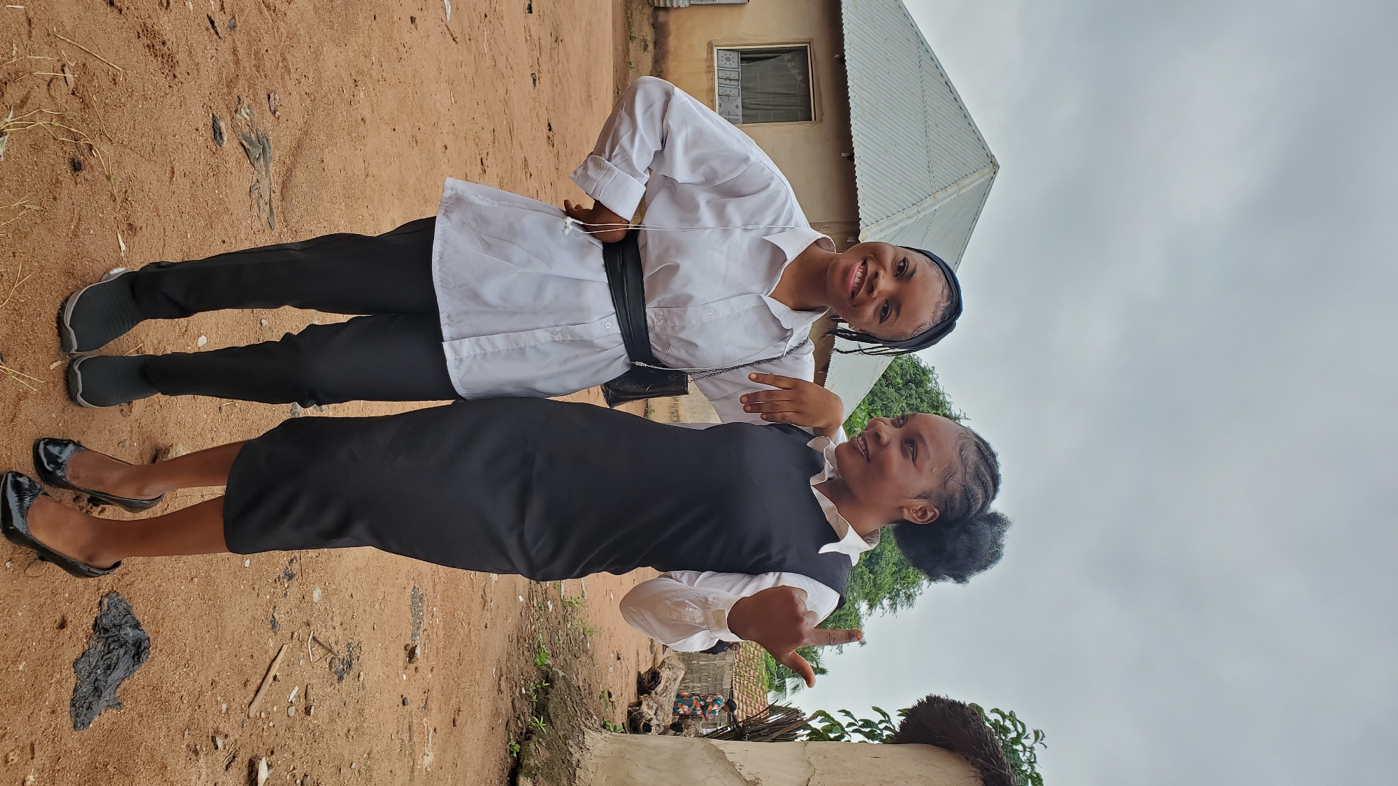 Friends posing outdoors in Jalingo, Nigeria