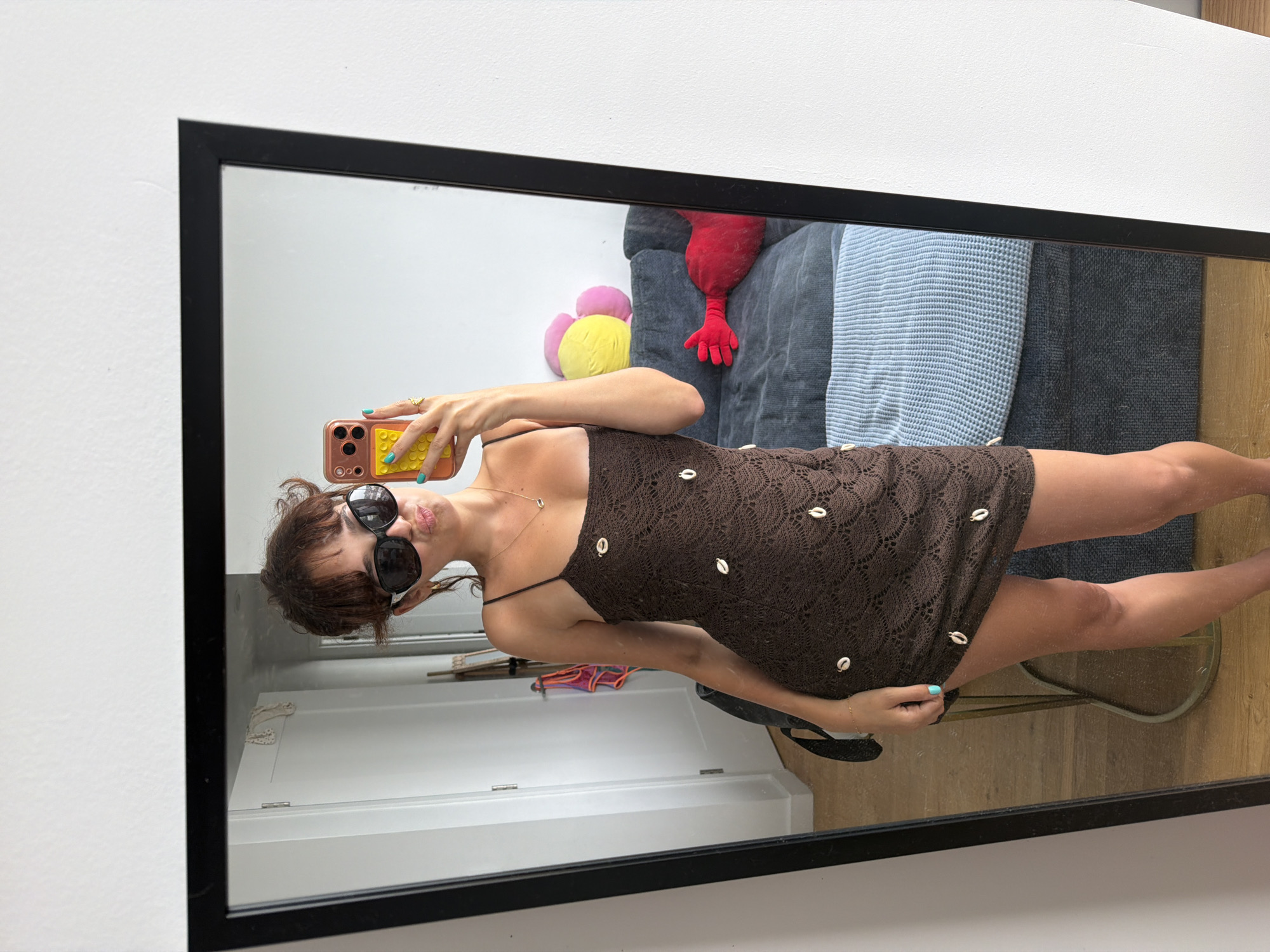 Crochet shell dress and mirror selfie in a NYC apartment