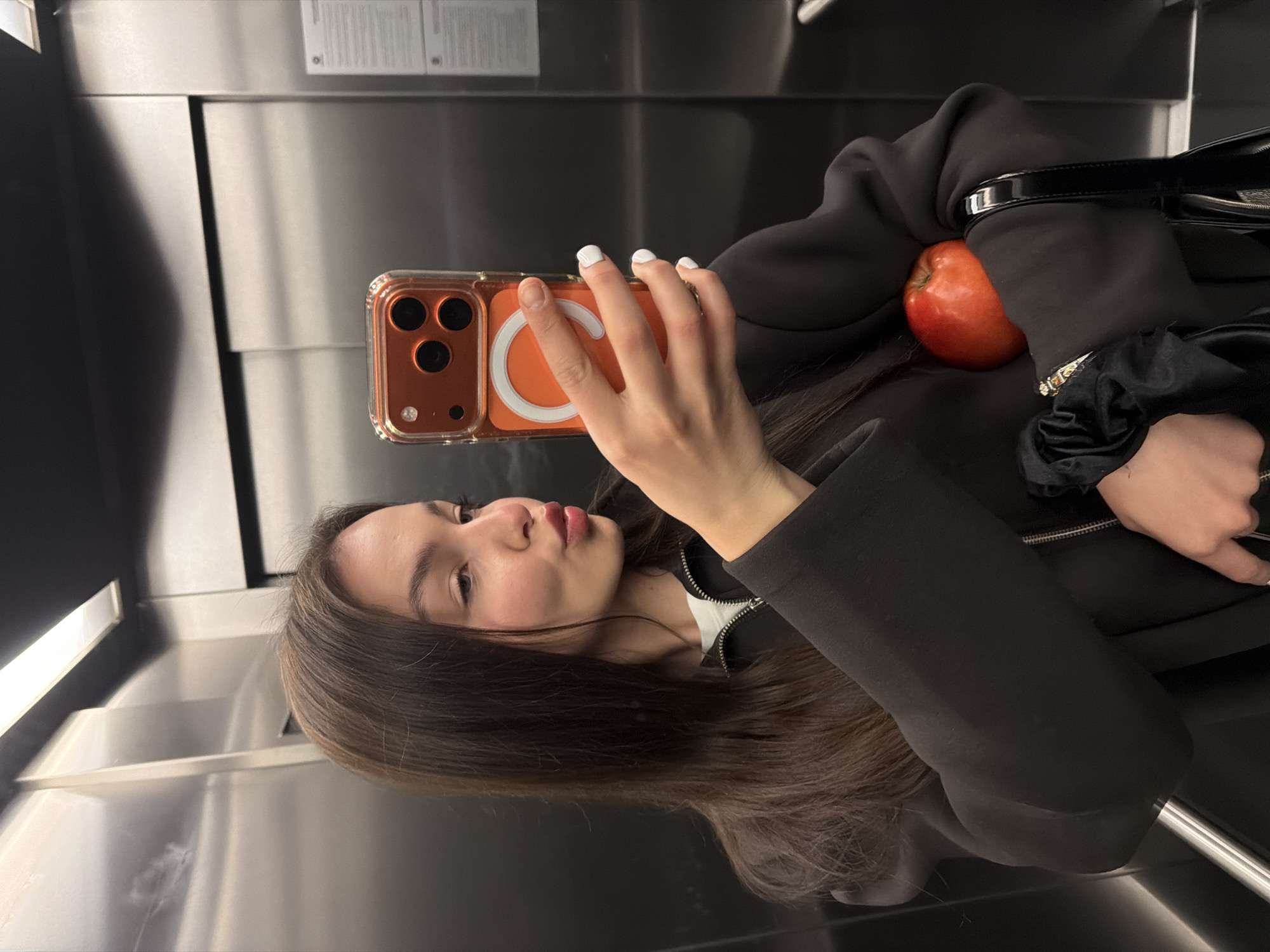 Woman Takes Multiple Selfies in Sofia Elevator