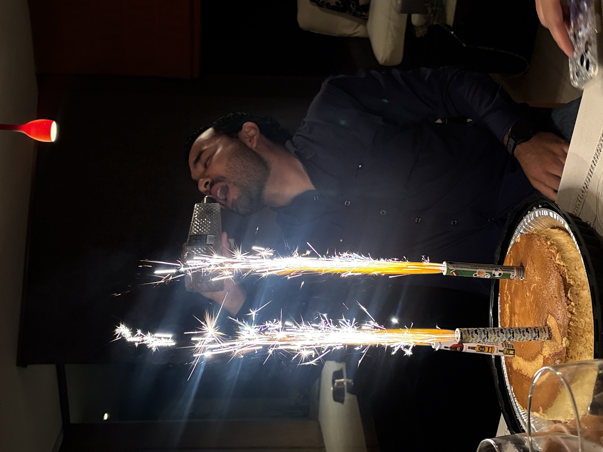Man celebrates with sparkler cake in Puebla, Mexico