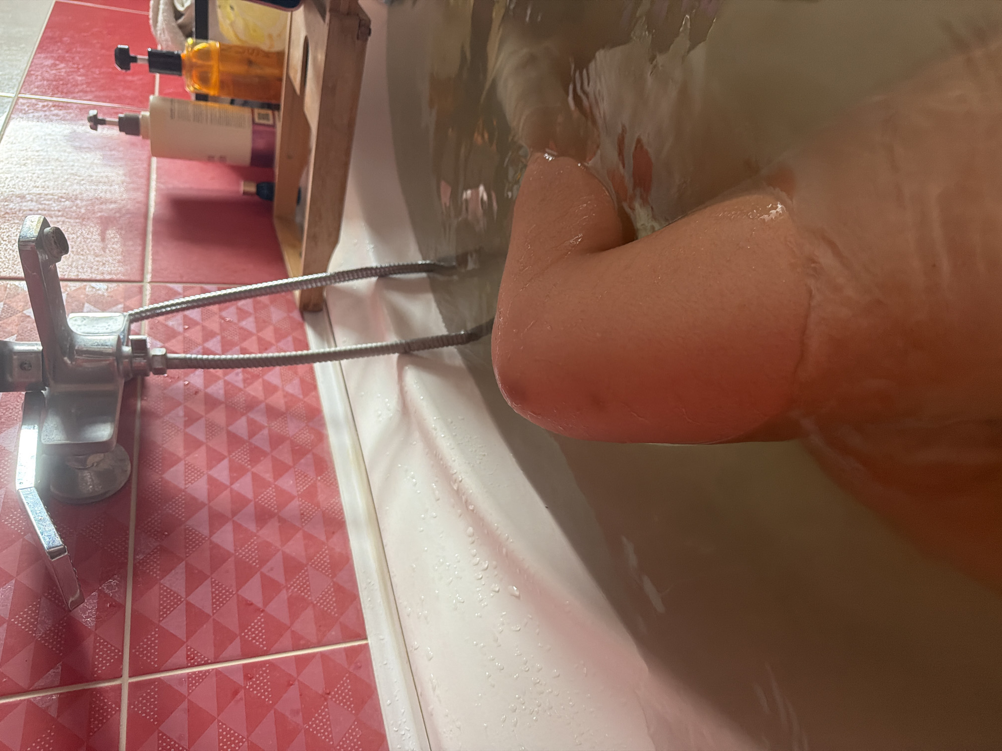 Relaxing in a tiled bathroom bathtub in rural Russia
