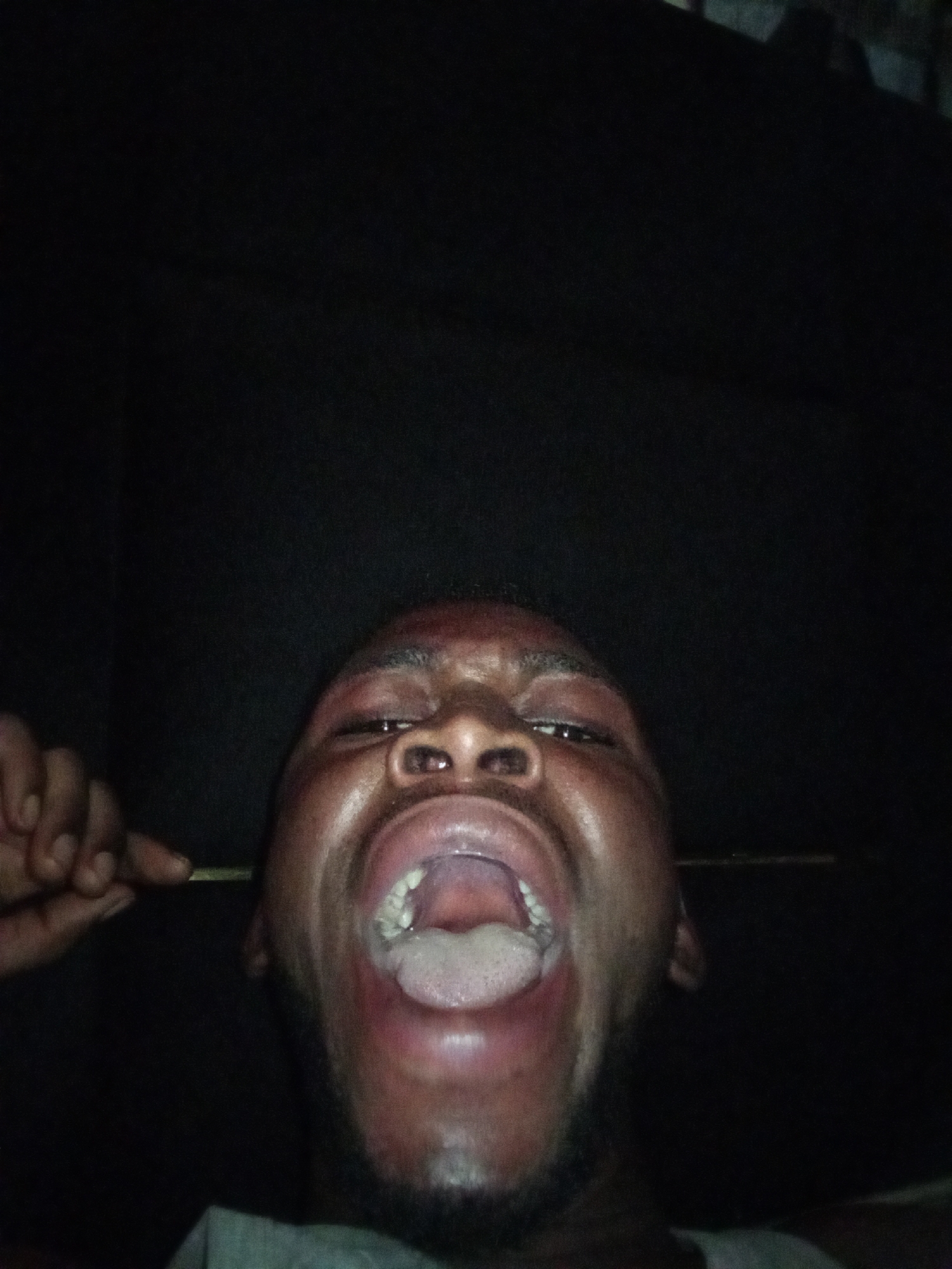 Man caught mid-expression with mouth wide open in Lokoja