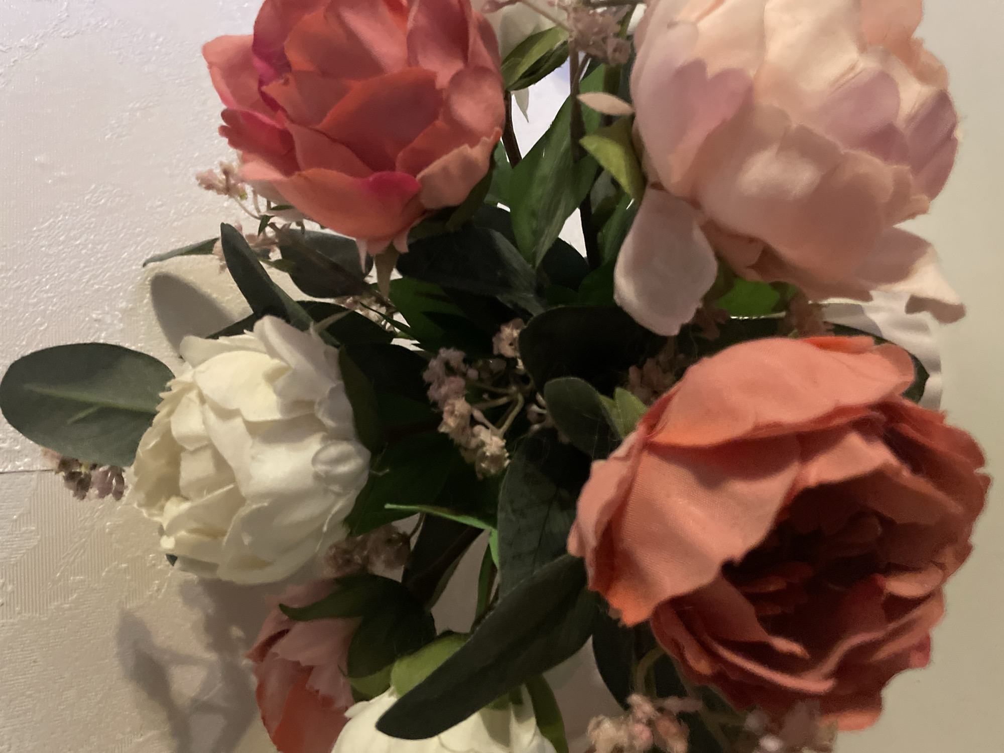 Cozy home details: flowers, a cat, and a still life painting