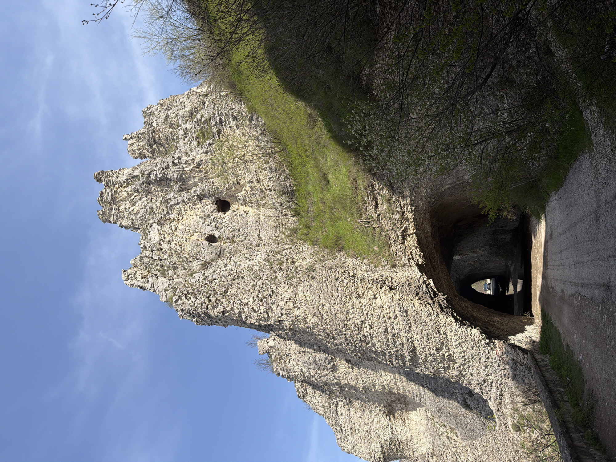 Tourist explores rock formations and bridge in Asparuhovo, Bulgaria