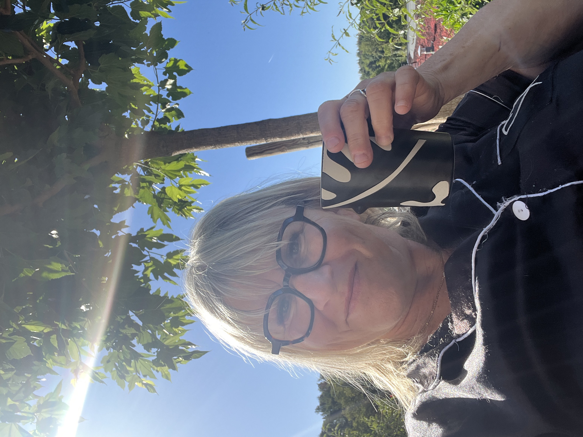 Morning coffee selfie in Chambœuf pajamas and blue skies