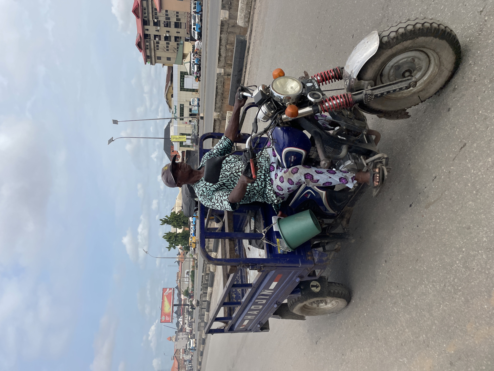 Lagos street market bustles with vendors, transport, ordinary commerce