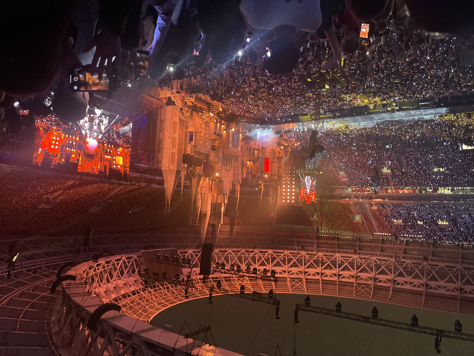 Packed stadium concert at Luzhniki with dramatic castle stage design