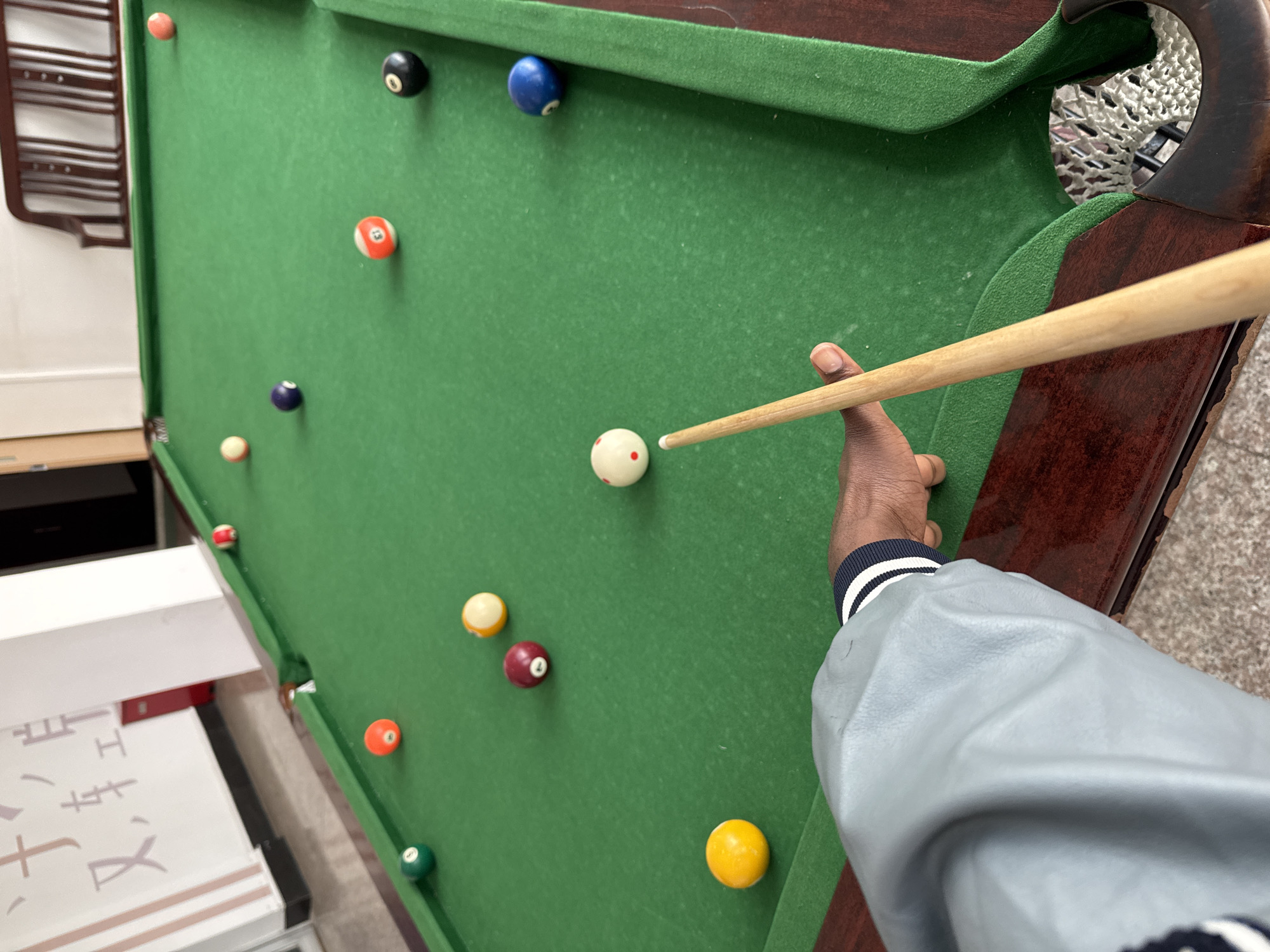 Late-night billiards session documented in Zhongtun, China
