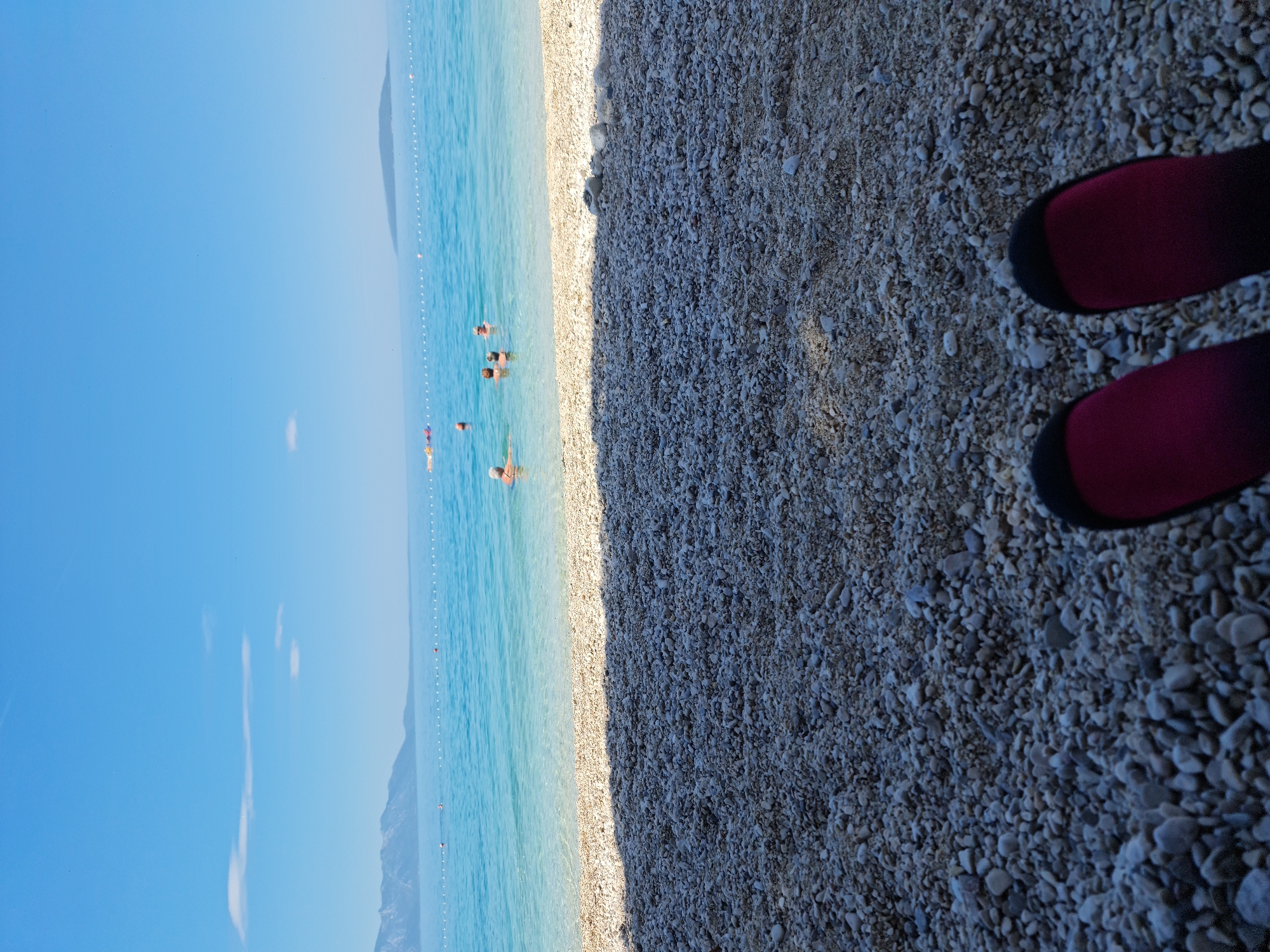 Summer morning on the Adriatic pebble beach at Gradac
